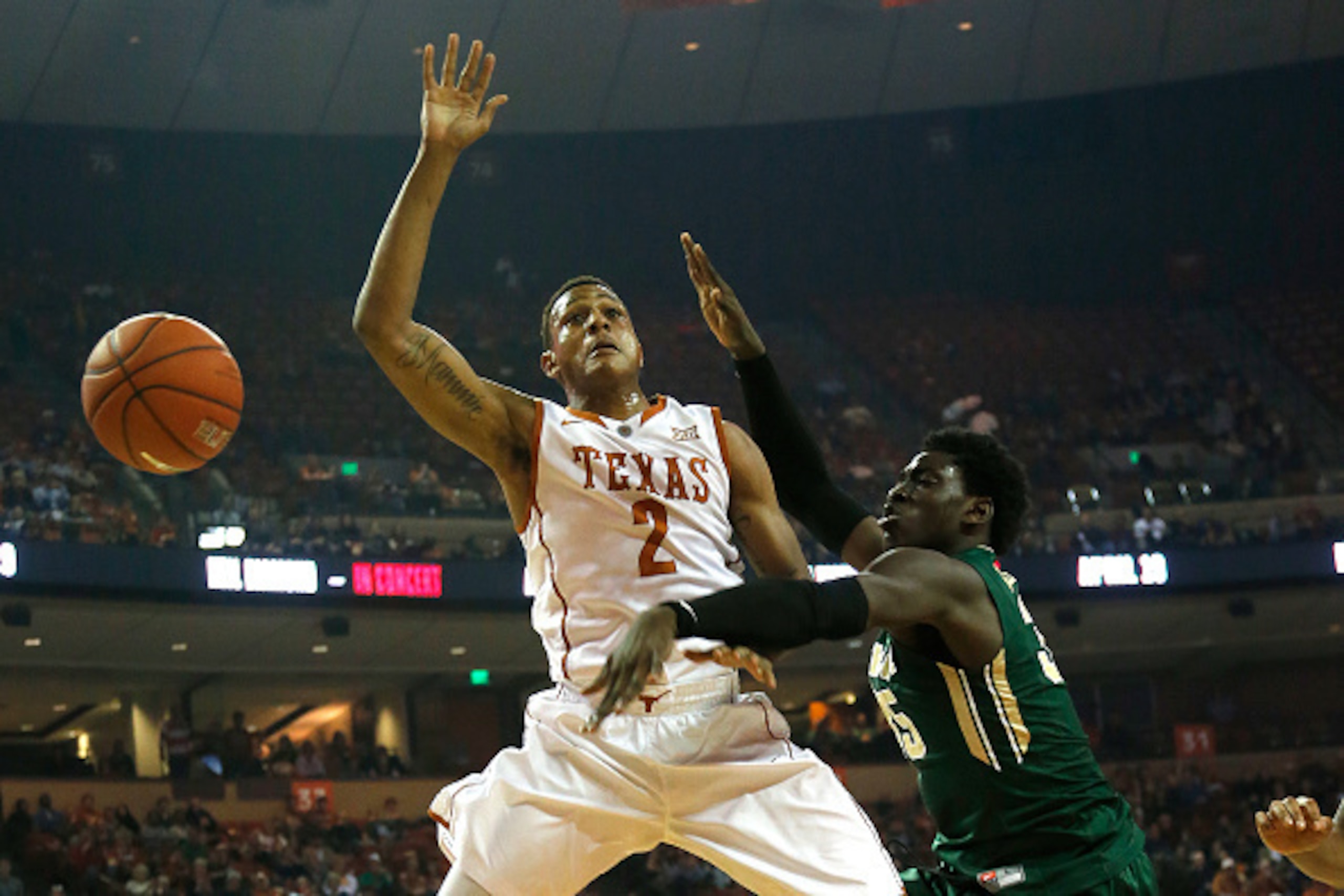 AUSTIN, TX - MARCH 2:  Demarcus Holland #2 of the Texas Longhorns shot has his shot blocked by Johnathan Motley #35 of the Baylor Bears at the Frank Erwin Center on March 2, 2015 in Austin, Texas. (Photo by Chris Covatta/Getty Images)