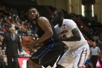 Dec 30, 2014; Corvallis, OR, USA; UC Santa Barbara Gauchos forward Alan Williams (left) tries to drive toward the basket while being defended by Oregon State Beavers center Cheikh N'diaye (5) during the first half of the game at Gill Coliseum. Mandatory C