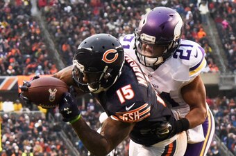 CHICAGO, IL - NOVEMBER 16: Brandon Marshall #15 of the Chicago Bears catches a touchdown pass over Josh Robinson #21 of the Minnesota Vikings during the fourth quarter of a game at Soldier Field on November 16, 2014 in Chicago, Illinois. (Photo by David B