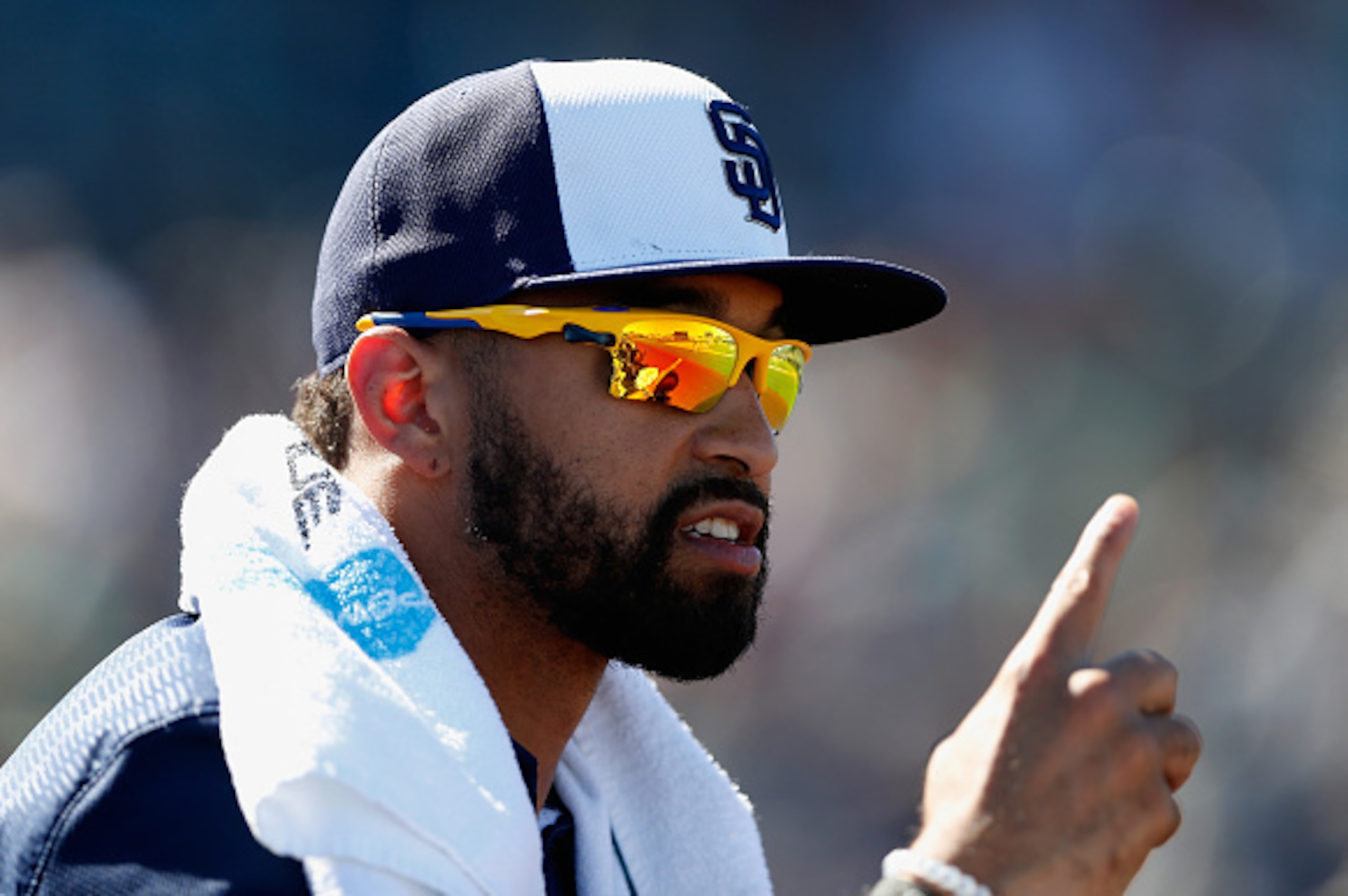 PEORIA, AZ - MARCH 05:  Matt Kemp #27 of the San Diego Padres watches from the dugout during the spring training game against the Seattle Mariners at Peoria Stadium on March 5, 2015 in Peoria, Arizona.  (Photo by Christian Petersen/Getty Images)