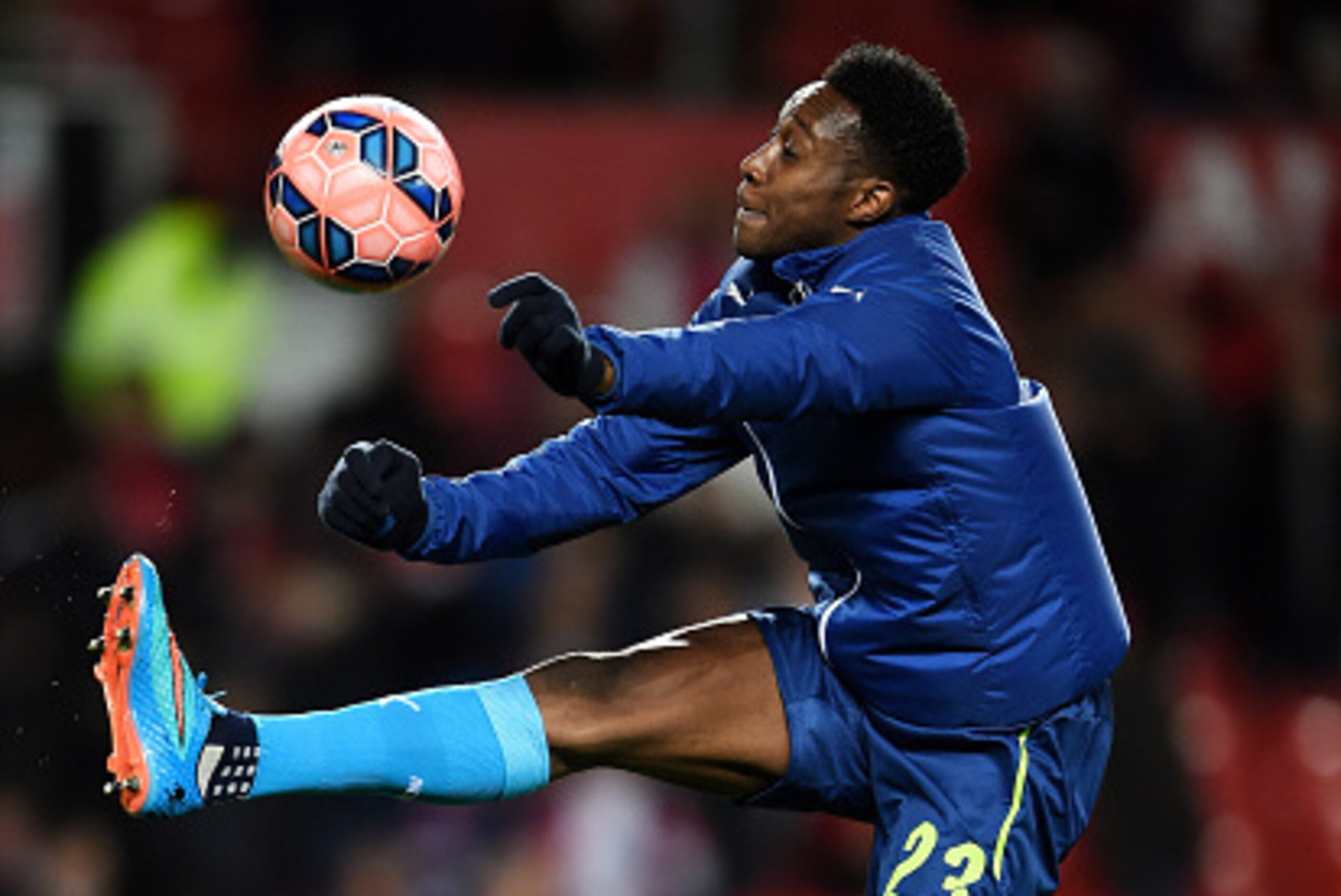 MANCHESTER, ENGLAND - MARCH 09:  Danny Welbeck of Arsenal warms up prior to kickoff during the FA Cup Quarter Final match between Manchester United and Arsenal at Old Trafford on March 9, 2015 in Manchester, England.  (Photo by Laurence Griffiths/Getty Im
