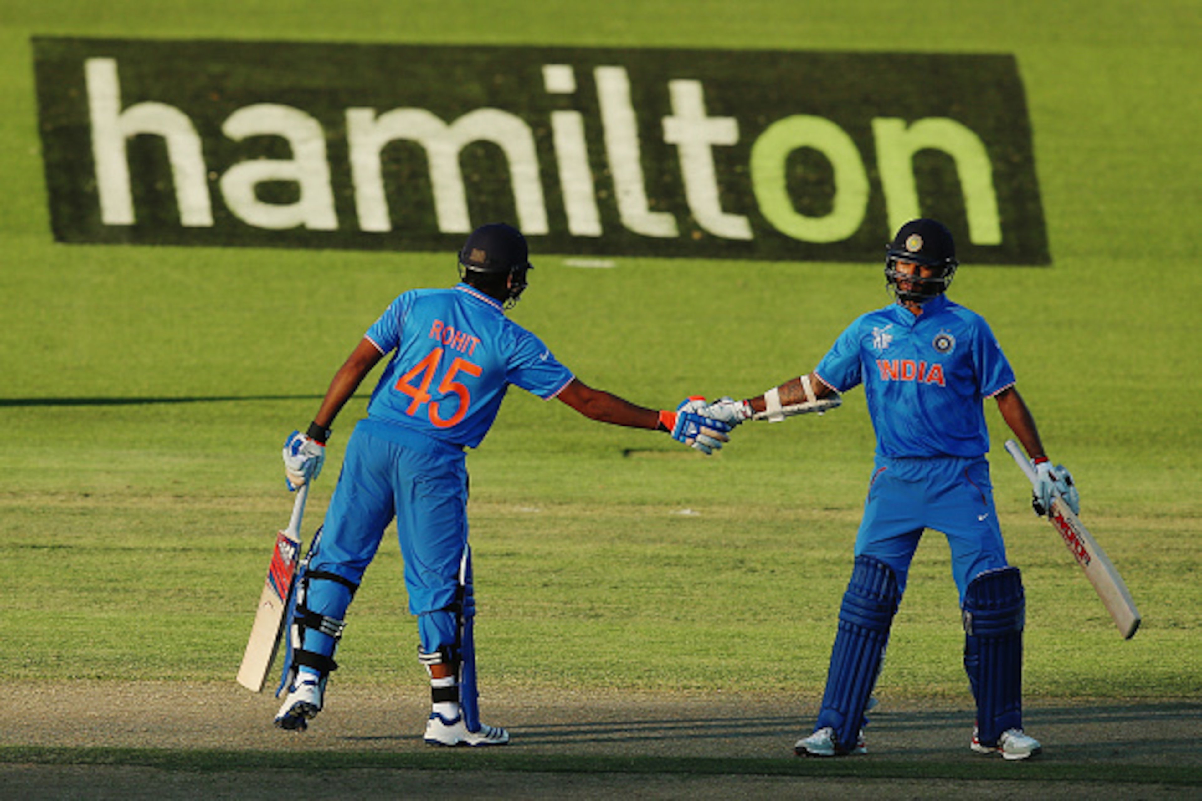 HAMILTON, NEW ZEALAND - MARCH 10:  Rohit Sharma of India conratulates Shikhar Dhawan of India after their 100 run partnership during the 2015 ICC Cricket World Cup match between Ireland and India at Seddon Park on March 10, 2015 in Hamilton, New Zealand. 