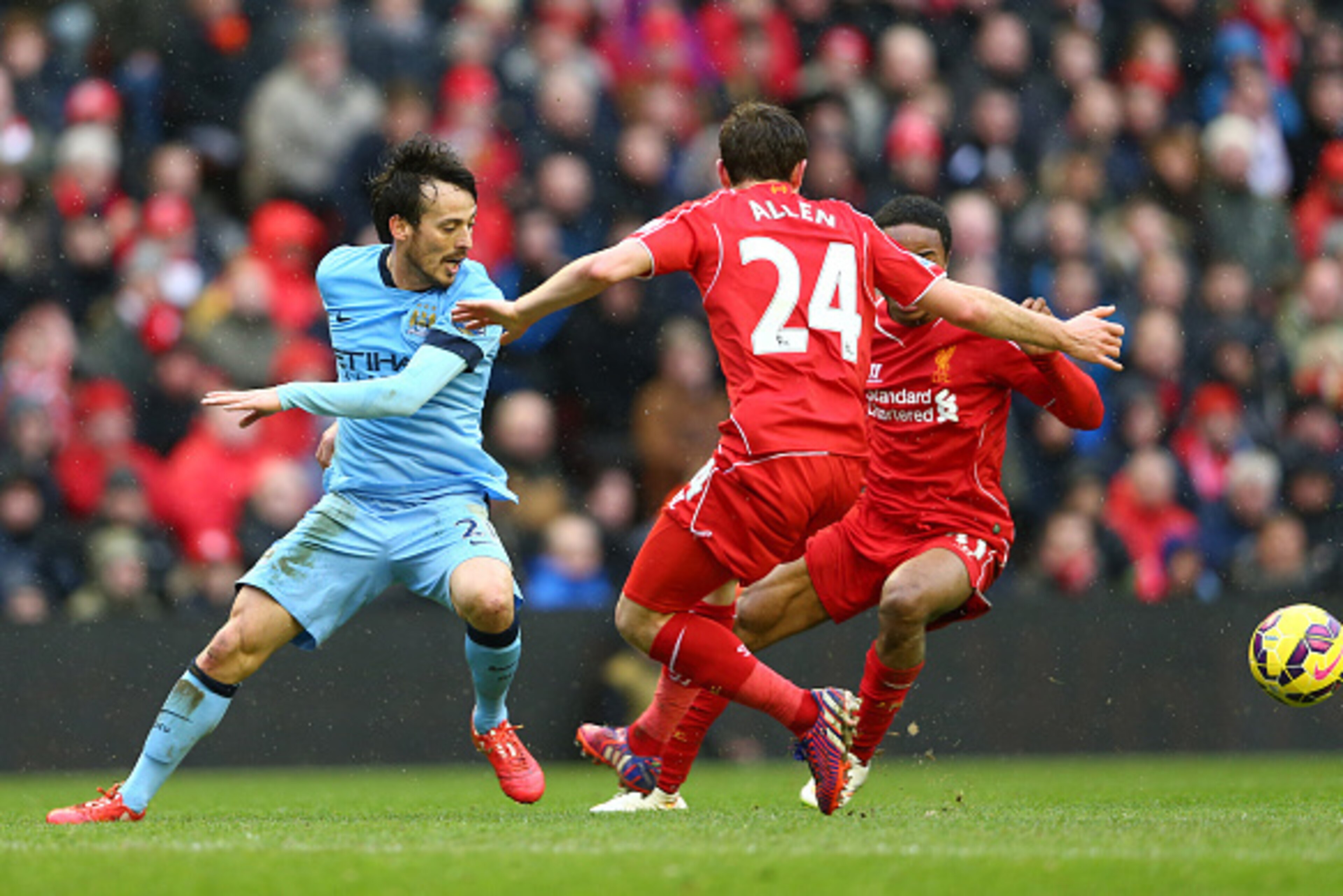 LIVERPOOL, ENGLAND - MARCH 01: David Silva of Manchester City in action with Joe Allen and Raheem Sterling of Liverpool during the Barclays Premier League match between Liverpool and Manchester City at Anfield on March 1, 2015 in Liverpool, England.  (Pho