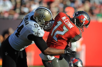 TAMPA, FL - DECEMBER 28: Defensive end Cameron Jordan #94 of the New Orleans Saints sacks quarterback Josh McCown #12 of the Tampa Bay Buccaneers in the fourth quarter at Raymond James Stadium on December 28, 2014 in Tampa, Florida. (Photo by Cliff McBrid