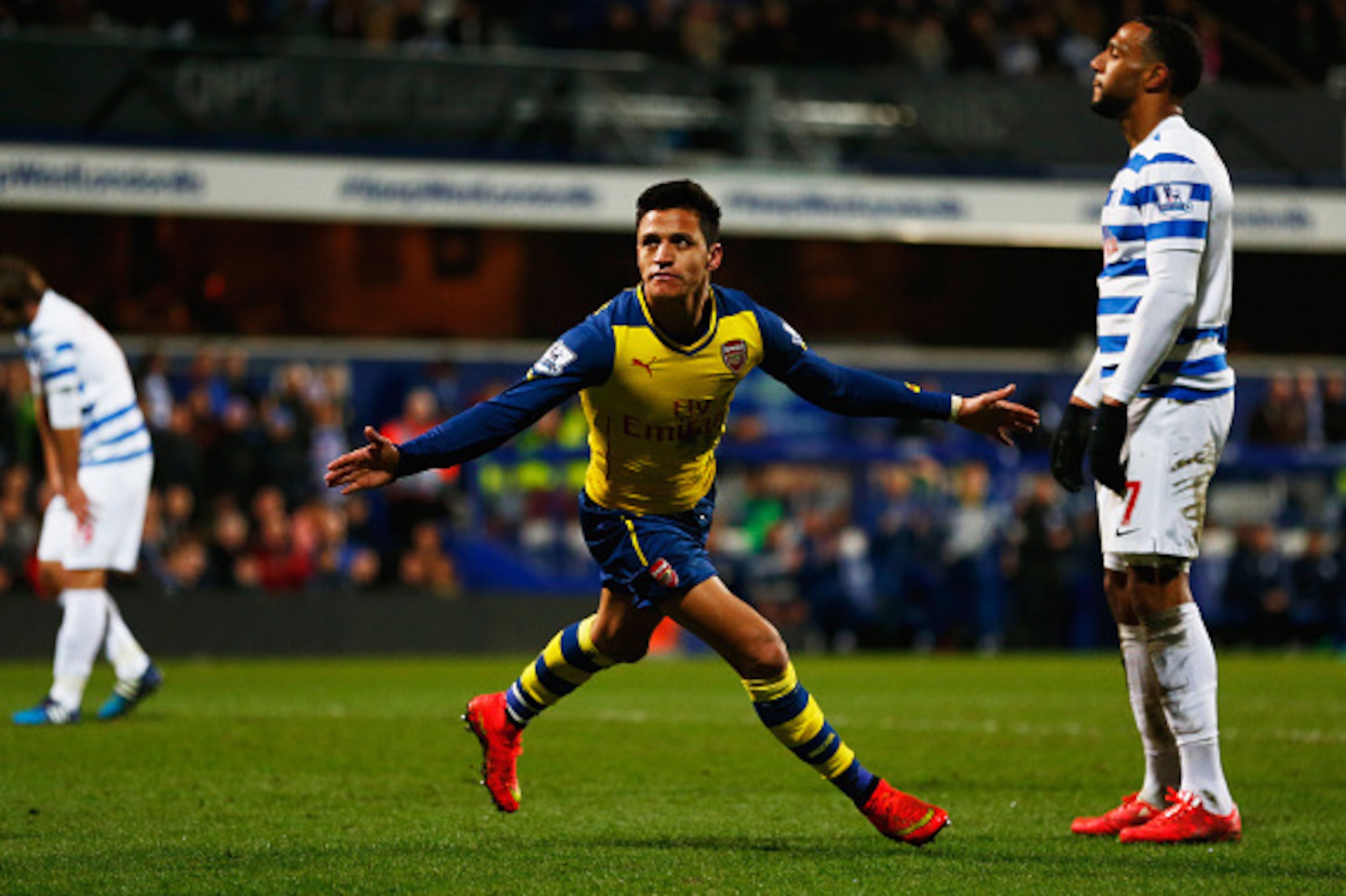 LONDON, ENGLAND - MARCH 04:  Despair for QPR players as Alexis Sanchez of Arsenal scores their second goal during the Barclays Premier League match between Queens Park Rangers and Arsenal at Loftus Road on March 4, 2015 in London, England.  (Photo by Juli