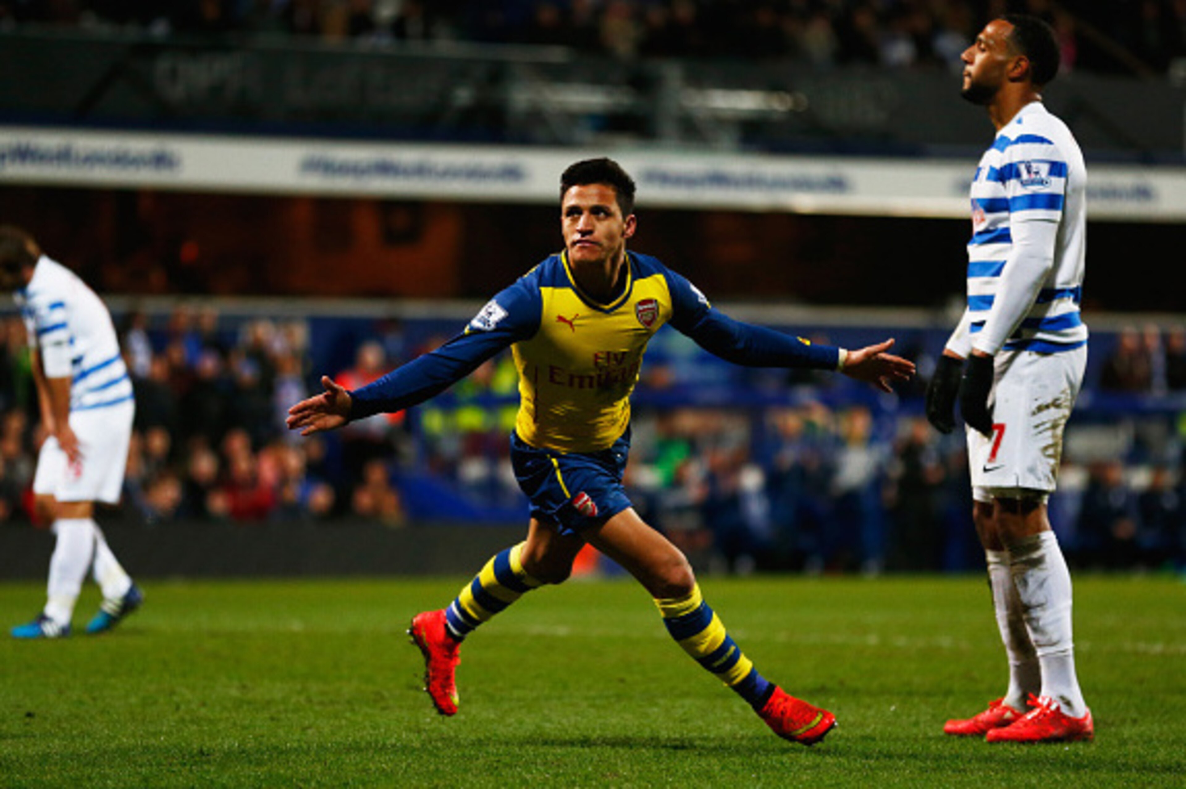 LONDON, ENGLAND - MARCH 04:  Despair for QPR players as Alexis Sanchez of Arsenal scores their second goal during the Barclays Premier League match between Queens Park Rangers and Arsenal at Loftus Road on March 4, 2015 in London, England.  (Photo by Juli