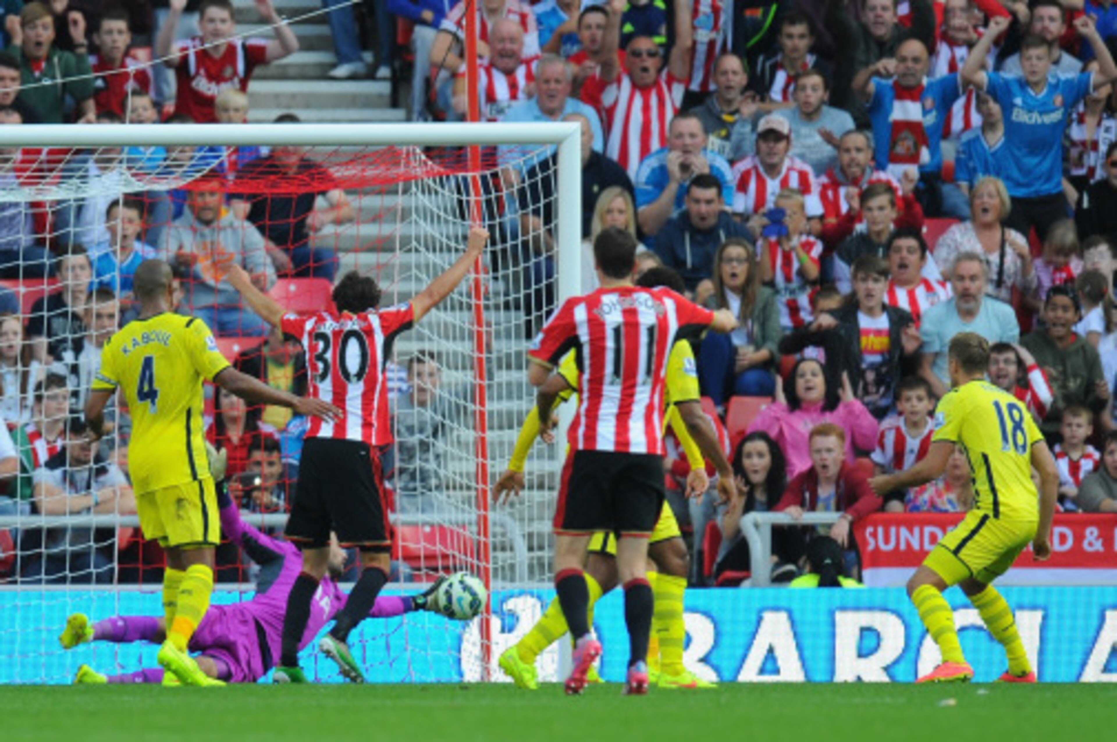 SUNDERLAND, ENGLAND - SEPTEMBER 13:  Spurs player Harry Kane (r) scores the own goal for the second  Sunderland goal during the Barclays Premier League match between Sunderland and Tottenham Hotspur at Stadium of Light on September 13, 2014 in Sunderland,