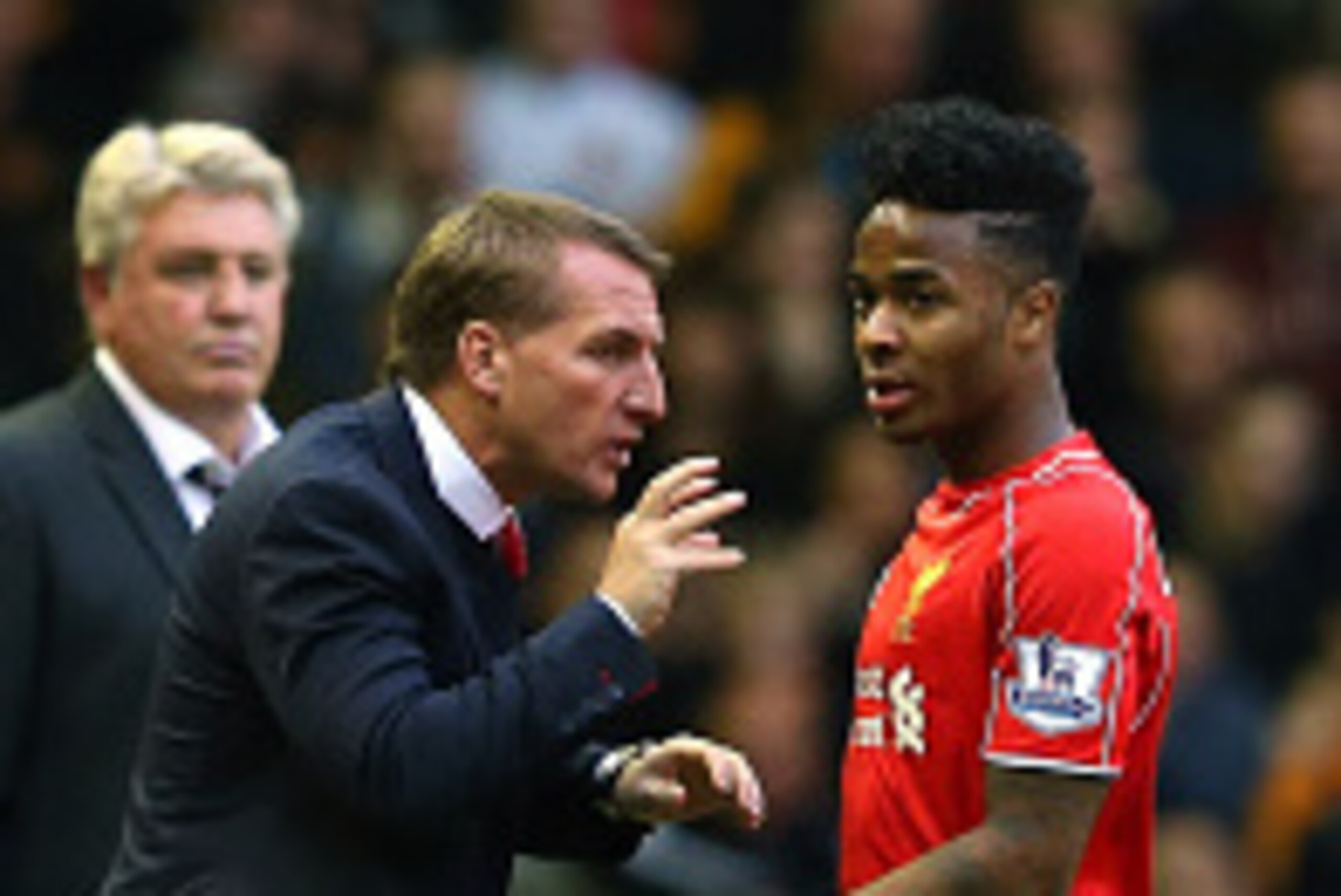 LIVERPOOL, ENGLAND - OCTOBER 25:  Brendan Rodgers the manager of Liverpool talks with Raheem Sterling during the Barclays Premier League match between Liverpool and Hull City at Anfield on October 25, 2014 in Liverpool, England.  (Photo by Alex Livesey/Ge