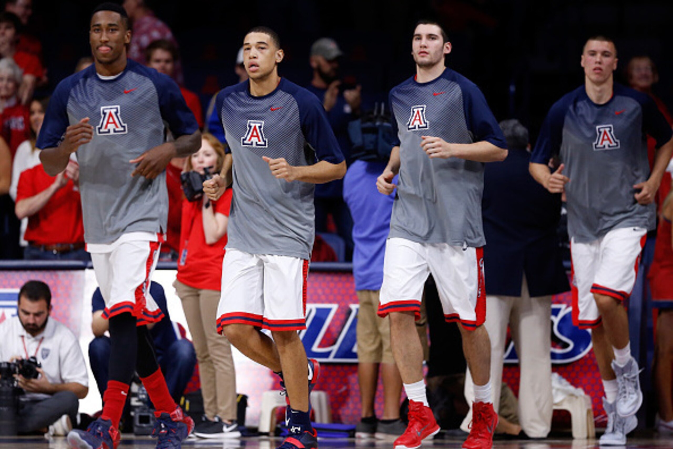 TUCSON, AZ - DECEMBER 09: (L-R) Rondae Hollis-Jefferson #23, Brandon Ashley #21, Matt Korcheck #31 and Kaleb Tarczewski #35 of the Arizona Wildcats run out onto the court before the college basketball game against the Utah Valley Wolverines at McKale Cen TUCSON, AZ - DECEMBER 09: (L-R) Rondae Hollis-Jefferson #23, Brandon Ashley #21, Matt Korcheck #31 and Kaleb Tarczewski #35 of the Arizona Wildcats run out onto the court before the college basketball game against the Utah Valley Wolverines at McKale Cen