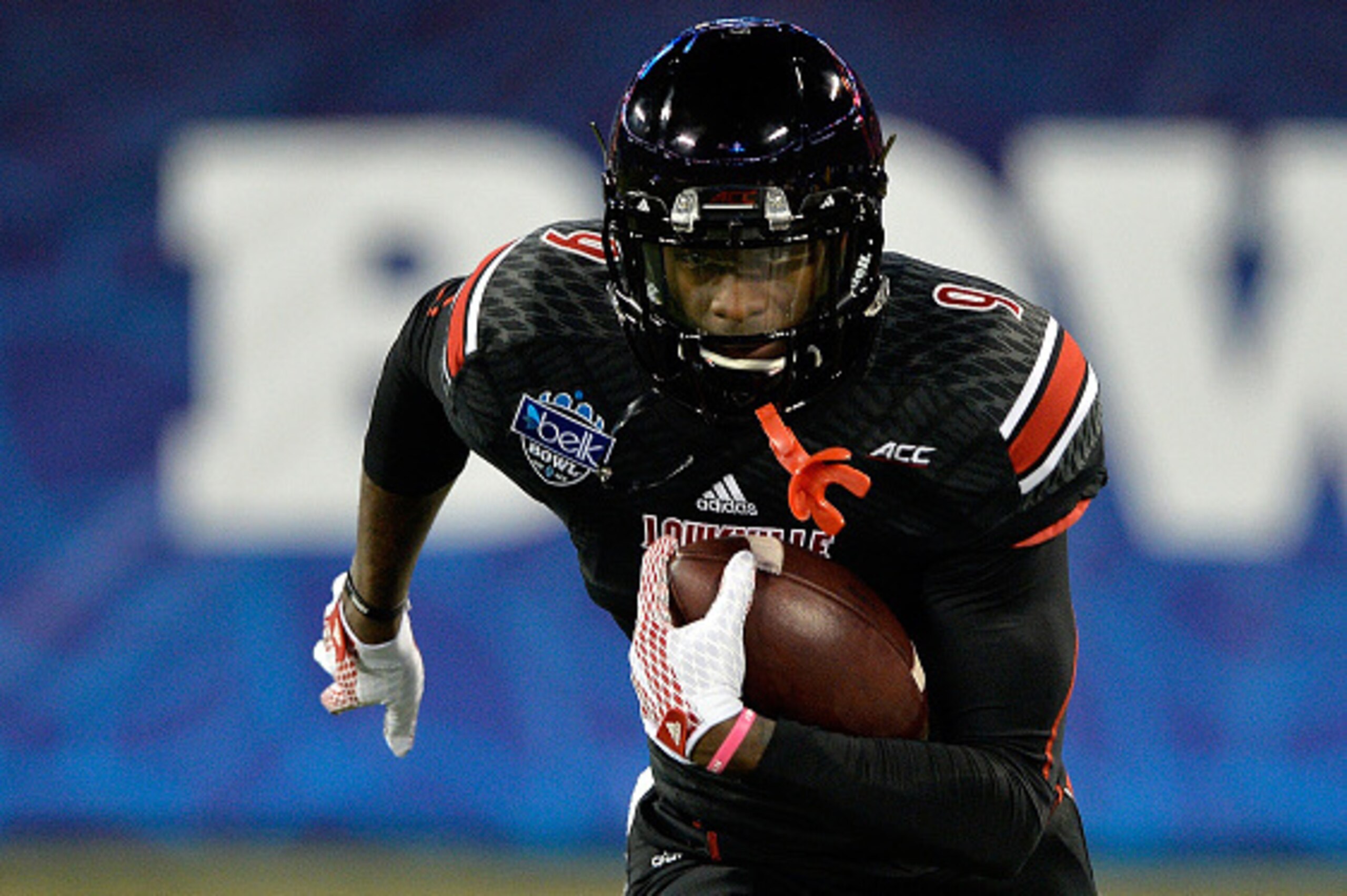 CHARLOTTE, NC - DECEMBER 30:  DeVante Parker #9 of the Louisville Cardinals warms up before the Belk Bowl against the Georgia Bulldogs at Bank of America Stadium on December 30, 2014 in Charlotte, North Carolina.  (Photo by Grant Halverson/Getty Images)