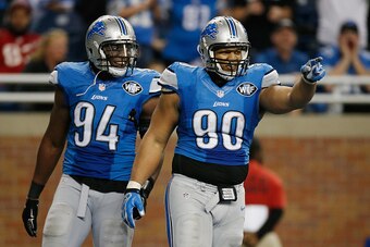 DETROIT, MI - DECEMBER 07: Ndamukong Suh #90 and Ezekiel Ansah #94 of the Detroit Lions celebrates a fourth quarter sack while playing the Tampa Bay Buccaneers at Ford Field on December 07, 2014 in Detroit, Michigan. Detroit won the game 34-17. (Photo by 