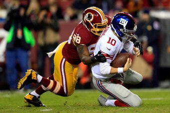 LANDOVER, MD - DECEMBER 01:  Brian Orakpo #98 of the Washington Redskins sacks Eli Manning #10 of the New York Giants in the first quarter during their game at FedExField on December 1, 2013 in Landover, Maryland.  (Photo by Rob Carr/Getty Images)
