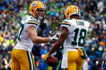 SEATTLE, WA - JANUARY 18:  Jordy Nelson #87 celebrates with  Randall Cobb #18 of the Green Bay Packers after Cobb catches a 13-yard touchdown in the first quarter during the 2015 NFC Championship game at CenturyLink Field on January 18, 2015 in Seattle, W