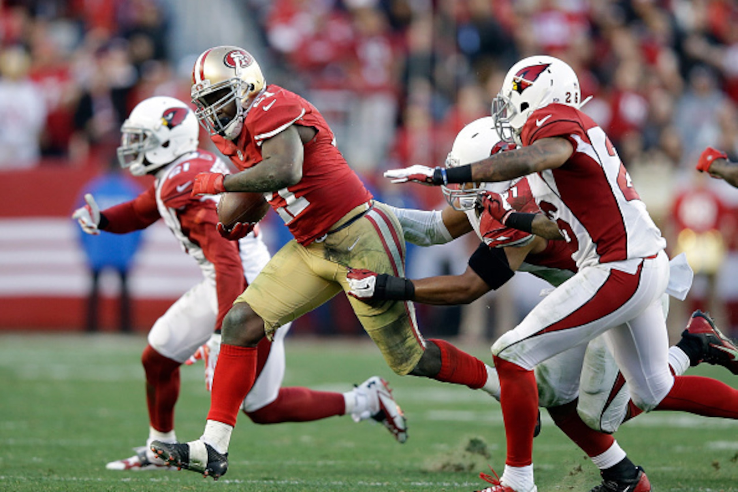 SANTA CLARA, CA - DECEMBER 28:  Frank Gore #21 of the San Francisco 49ers runs with the ball against the Arizona Cardinals at Levi's Stadium on December 28, 2014 in Santa Clara, California.  (Photo by Ezra Shaw/Getty Images)