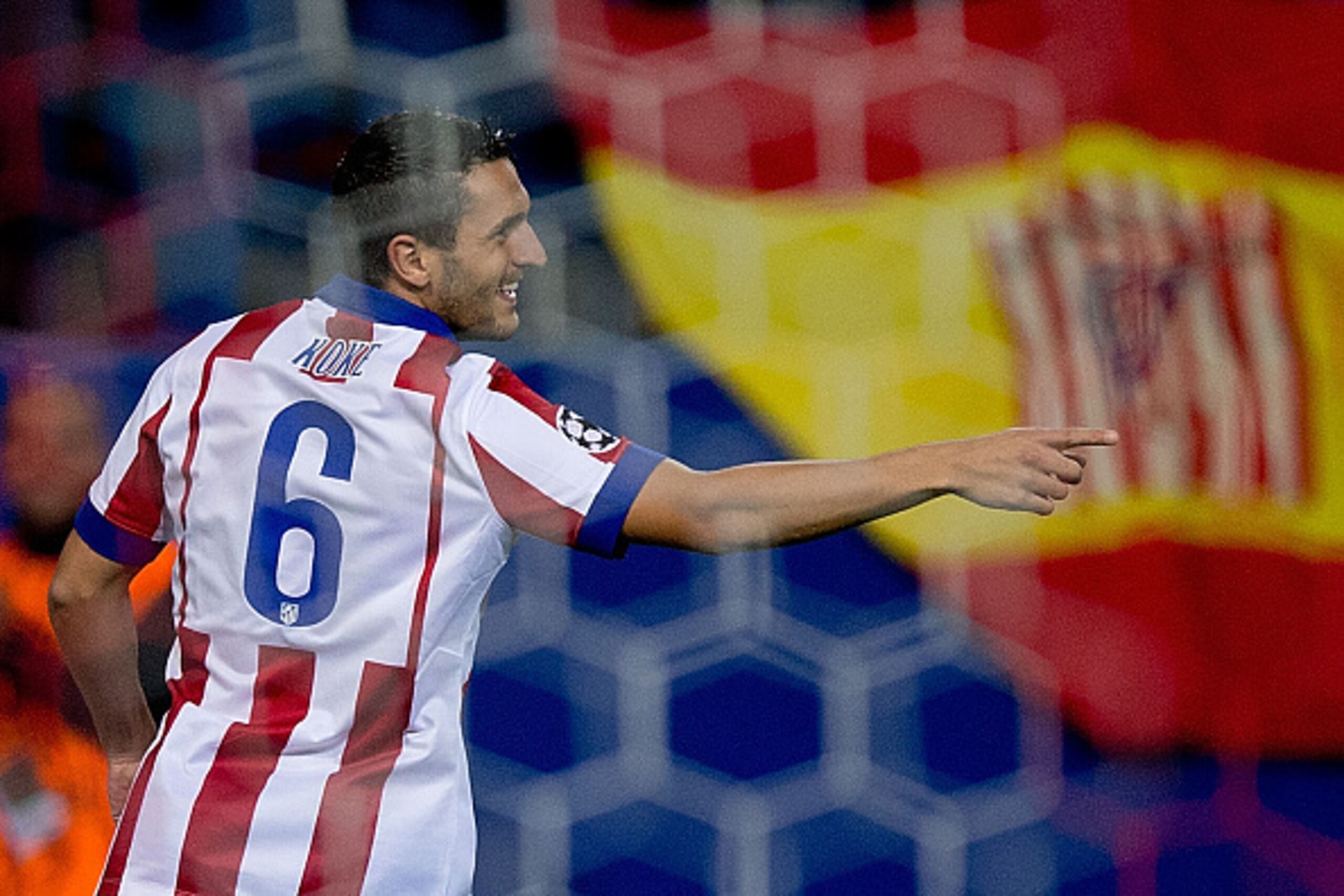 MADRID, SPAIN - OCTOBER 22: Koke of Atletico de Madrid celebrates scoring their opening goal during the UEFA Champions League group A match between Club Atletico de Madrid and Malmo FF at Vicente Calderon stadium on October 22, 2014 in Madrid, Spain.  (Ph