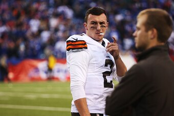 ORCHARD PARK, NY - NOVEMBER 30:   Johnny Manziel #2 of the Cleveland Browns watches the game against the Buffalo Bills during the second half at Ralph Wilson Stadium on November 30, 2014 in Orchard Park, New York.  (Photo by Tom Szczerbowski/Getty Images)