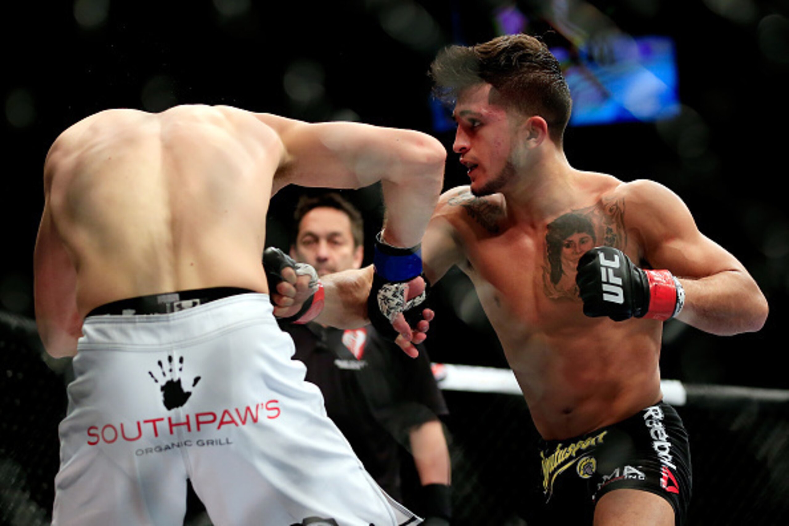 LAS VEGAS, NV - DECEMBER 06:  Sergio Pettis lands a punch against Matt Hobar in their fight during the UFC 181 event at the Mandalay Bay Events Center on December 6, 2014 in Las Vegas, Nevada.  (Photo by Alex Trautwig/Getty Images)