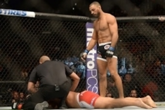 Feb 28, 2015; Los Angeles, CA, USA;  Referee Jerin Valel stops the fight as Mark Munoz (red gloves) lays on the mat during his Middleweight bout against Roan Carneiro (blue gloves) at UFC 184 at Staples Center. Carneiro won by submission. Mandatory Credit