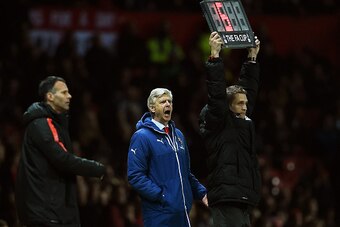MANCHESTER, ENGLAND - MARCH 09:  Arsene Wenger the manager of Arsenal reacts during the FA Cup Quarter Final match between Manchester United and Arsenal at Old Trafford on March 9, 2015 in Manchester, England.  (Photo by Laurence Griffiths/Getty Images)