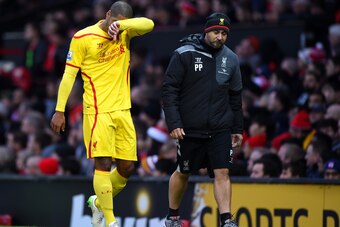 MANCHESTER, ENGLAND - DECEMBER 14:  Glen Johnson of Liverpool goes off after sustaining an injury during the Barclays Premier League match between Manchester United and Liverpool at Old Trafford on December 14, 2014 in Manchester, England.  (Photo by Shau