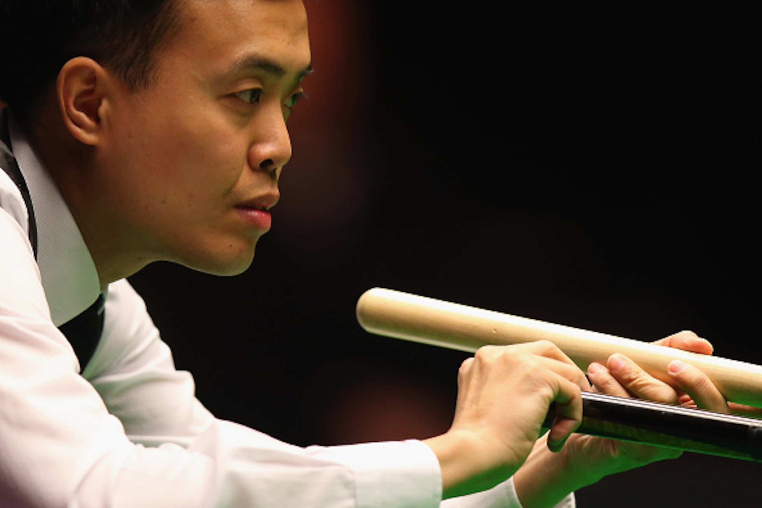LONDON, ENGLAND - JANUARY 15:  Marco Fu of Hong Kong in action during his quarter-final match against Ronnie O'Sullivan on Day Five of the 2015 Dafabet Masters at Alexandra Palace on January 15, 2015 in London, England.  (Photo by Bryn Lennon/Getty Images