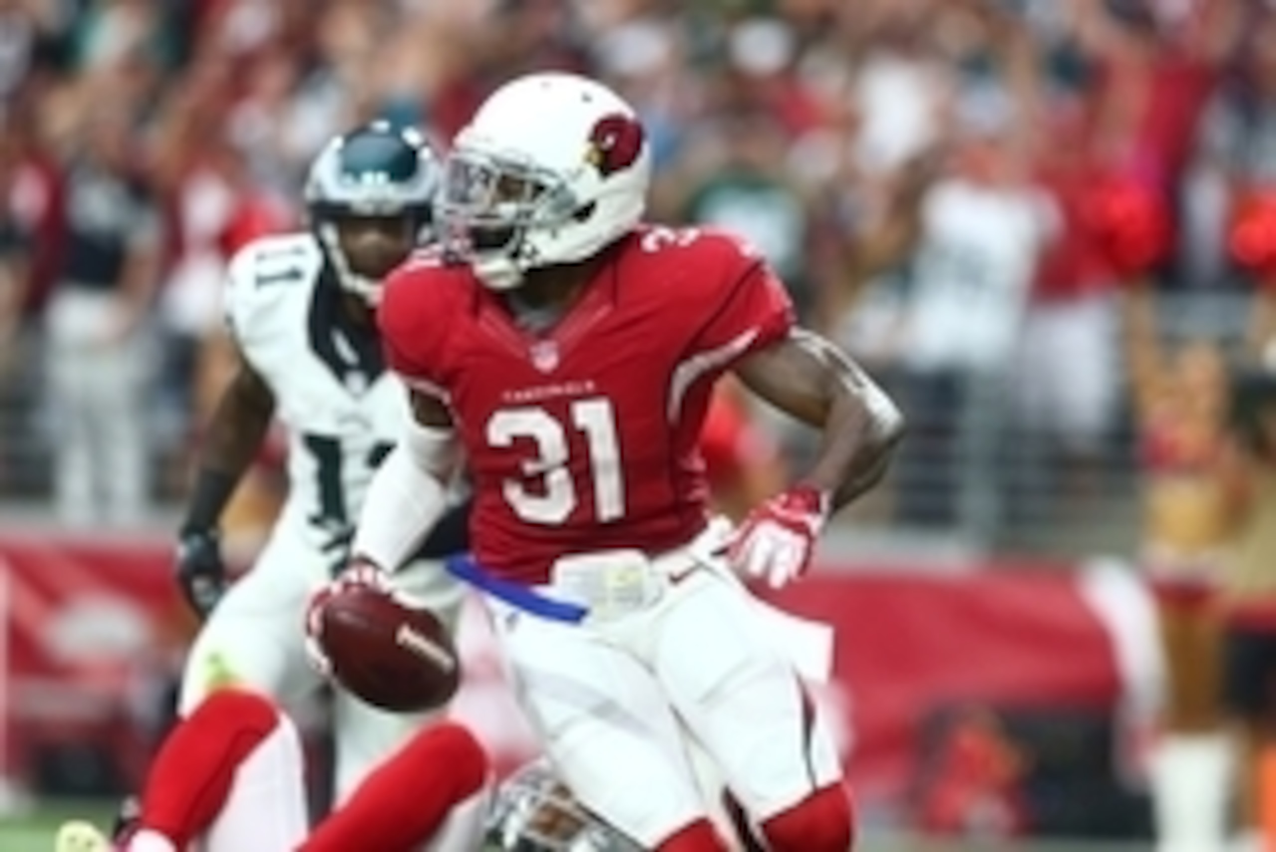 Oct 26, 2014; Glendale, AZ, USA; Arizona Cardinals cornerback Antonio Cromartie (31) intercepts a pass in the second quarter against the Philadelphia Eagles at University of Phoenix Stadium. Mandatory Credit: Mark J. Rebilas-USA TODAY Sports Oct 26, 2014; Glendale, AZ, USA; Arizona Cardinals cornerback Antonio Cromartie (31) intercepts a pass in the second quarter against the Philadelphia Eagles at University of Phoenix Stadium. Mandatory Credit: Mark J. Rebilas-USA TODAY Sports