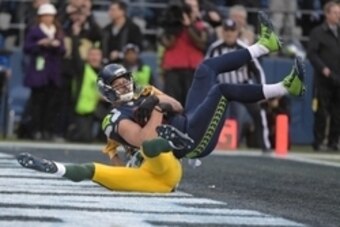 Jan 18, 2015; Seattle, WA, USA;  Seattle Seahawks wide receiver Jermaine Kearse (15) scores the game winning touchdown on a pass of 35 yards defended by Green Bay Packers cornerback Tramon Williams (38) in overtime in the NFC Championship Game at CenturyL