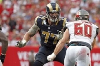 Sep 14, 2014; Tampa, FL, USA; St. Louis Rams tackle Jake Long (77) blocks against the Tampa Bay Buccaneers during the second half at Raymond James Stadium. St. Louis Rams defeated the Tampa Bay Buccaneers 19-17. Mandatory Credit: Kim Klement-USA TODAY Spo