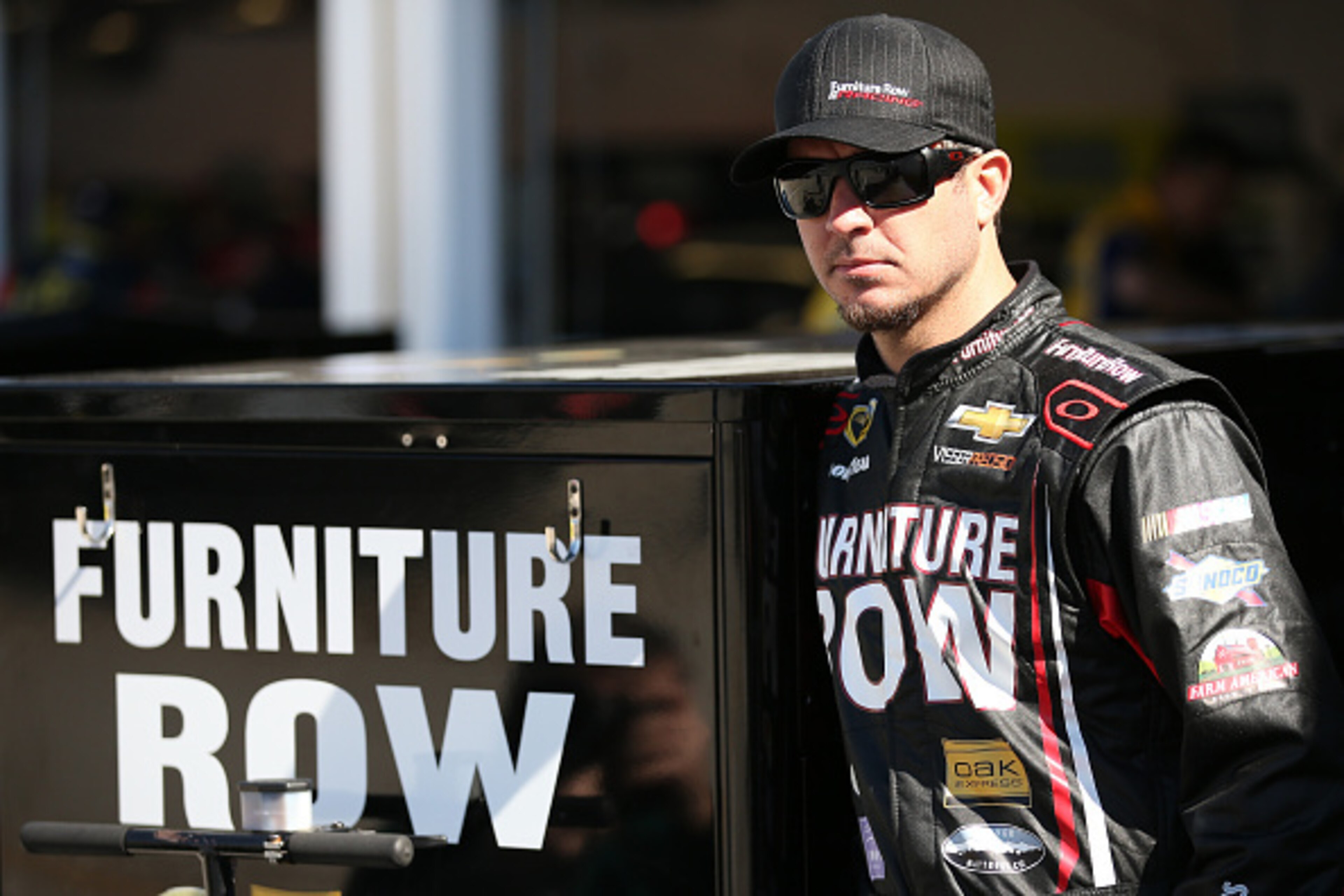 DAYTONA BEACH, FL - FEBRUARY 14: Martin Truex Jr., driver of the #78 Furniture Row/Visser Percision Chevrolet, stands in the garage area during practice for the 57th Annual Daytona 500 at Daytona International Speedway on February 14, 2015 in Daytona Bea DAYTONA BEACH, FL - FEBRUARY 14: Martin Truex Jr., driver of the #78 Furniture Row/Visser Percision Chevrolet, stands in the garage area during practice for the 57th Annual Daytona 500 at Daytona International Speedway on February 14, 2015 in Daytona Bea