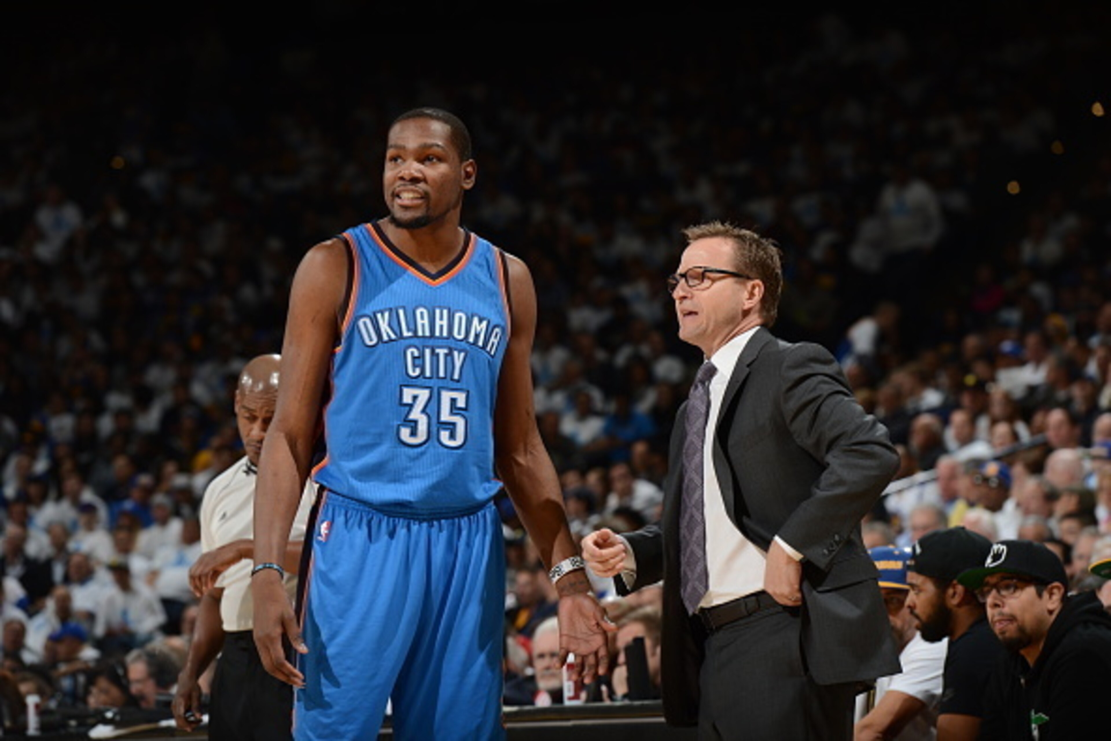 OAKLAND, CA - JANUARY 5:  Kevin Durant #35 and Head coach Scott Brooks of the Oklahoma City Thunder talk during the game against the Golden State Warriors on January 5, 2015 at Oracle Arena in Oakland, California. NOTE TO USER: User expressly acknowledges