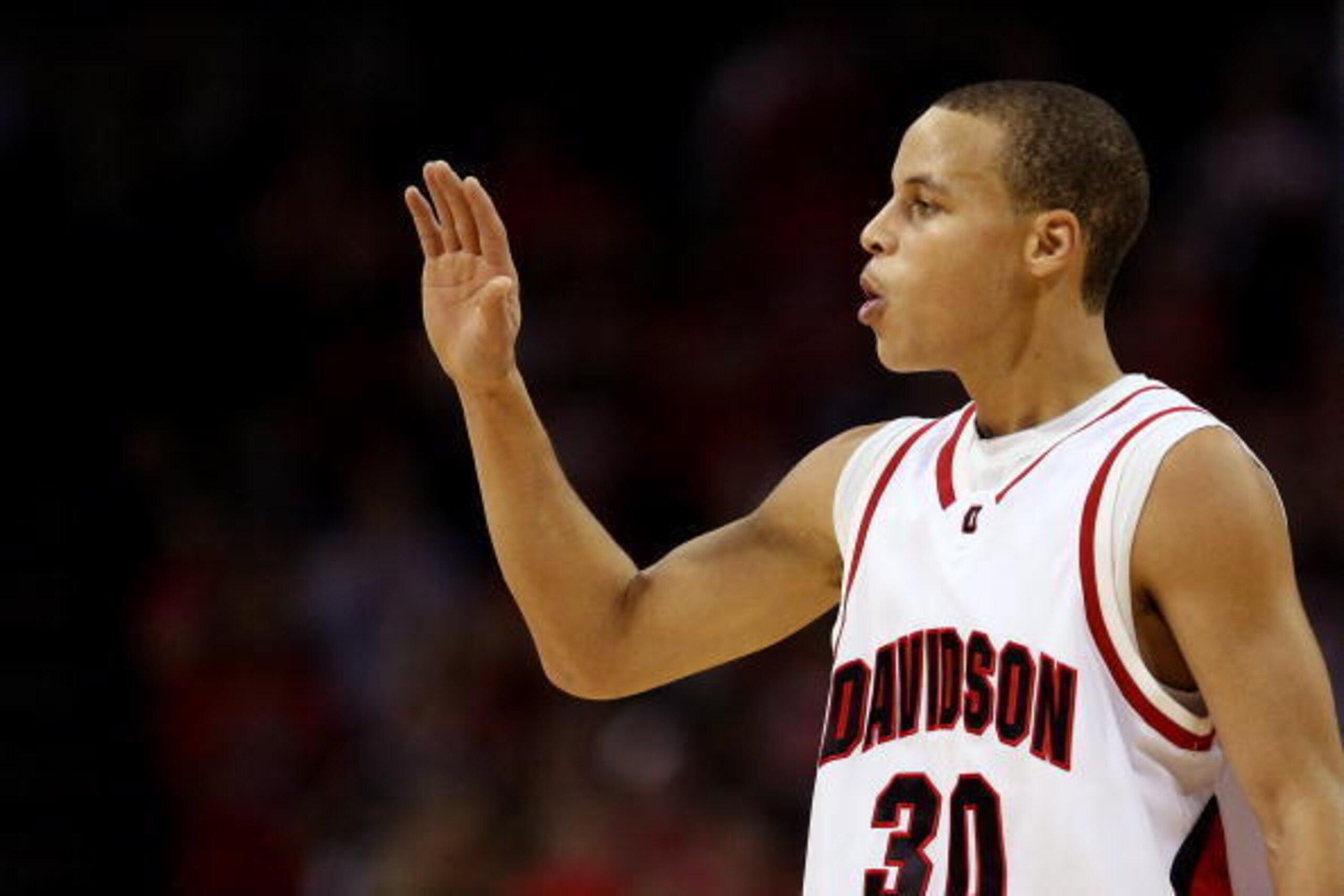 CHARLOTTE, NC - DECEMBER 06:  Stephen Curry #30 of the Davidson Wildcats reacts to his team's 72-67 victory over the North Carolina State Wolfpack during their game at Time Warner Cable Arena on December 6, 2008 in Charlotte, North Carolina.  (Photo by St
