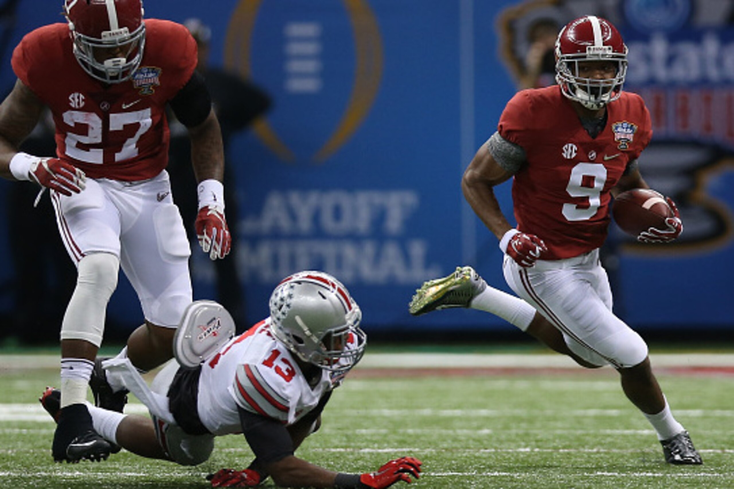 NEW ORLEANS, LA - JANUARY 01:  Amari Cooper #9 of the Alabama Crimson Tide runs the ball in the first quarter against the Ohio State Buckeyes during the All State Sugar Bowl at the Mercedes-Benz Superdome on January 1, 2015 in New Orleans, Louisiana.  (Ph