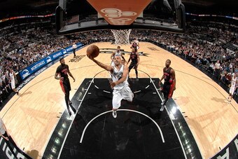 SAN ANTONIO, TX - MARCH 10:  Tony Parker #9 of the San Antonio Spurs goes to the basket against the Toronto Raptors on March 10, 2015 at the AT&T Center in San Antonio, Texas. NOTE TO USER: User expressly acknowledges and agrees that, by downloading and o