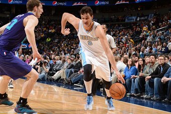 DENVER, CO - JANUARY 31:  Danilo Gallinari #8 of the Denver Nuggets handles the ball against the Charlotte Hornets during the game on January 31, 2015 at the Pepsi Center in Denver, Colorado. NOTE TO USER: User expressly acknowledges and agrees that, by d