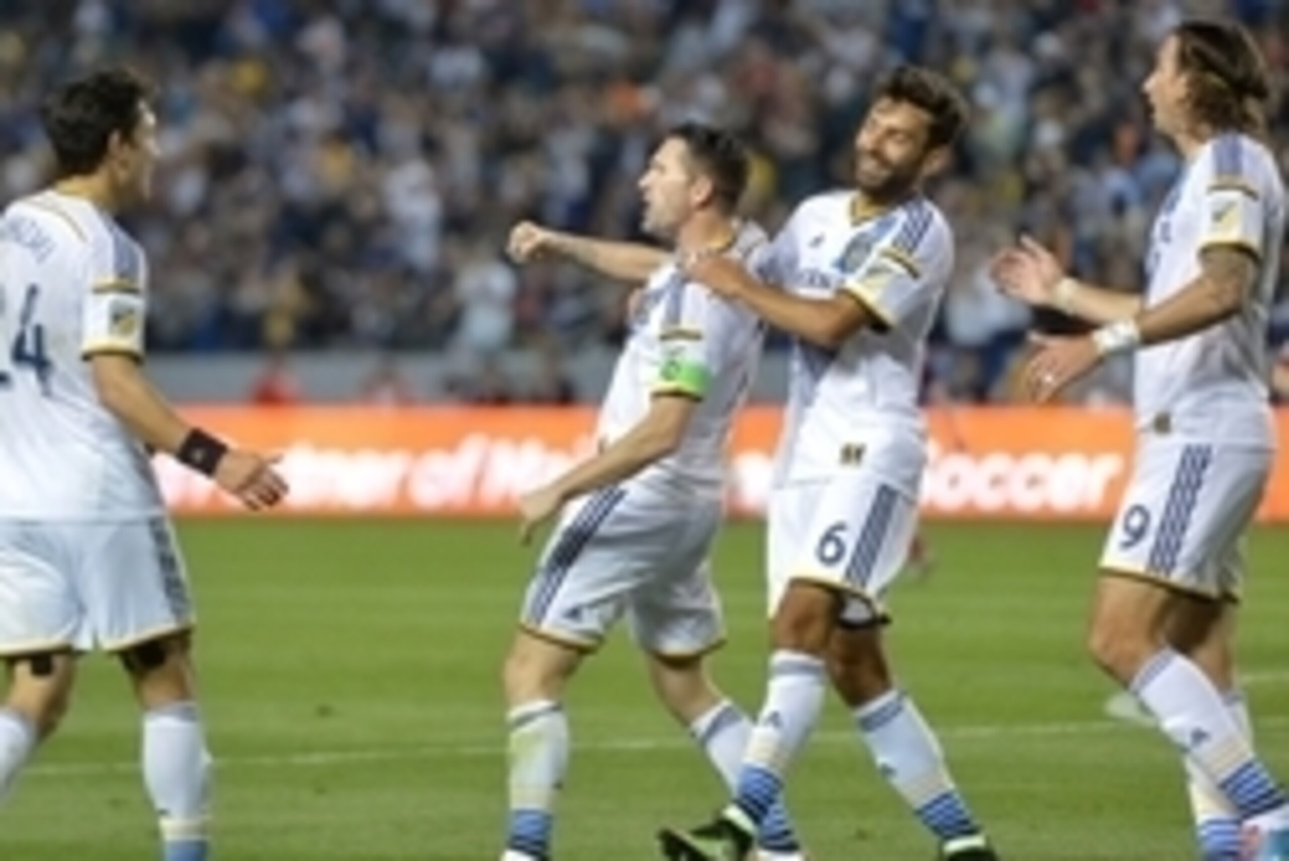 Mar 6, 2015; Carson, CA, USA; Los Angeles Galaxy forward Robbie Keane (7) celebrates with teammates Stefan Ishizaki (24), Baggio Husidic (6) and Alan Gordon (9) after scoring a goal in the second half against the Chicago Fire at StubHub Center. The Galaxy Mar 6, 2015; Carson, CA, USA; Los Angeles Galaxy forward Robbie Keane (7) celebrates with teammates Stefan Ishizaki (24), Baggio Husidic (6) and Alan Gordon (9) after scoring a goal in the second half against the Chicago Fire at StubHub Center. The Galaxy