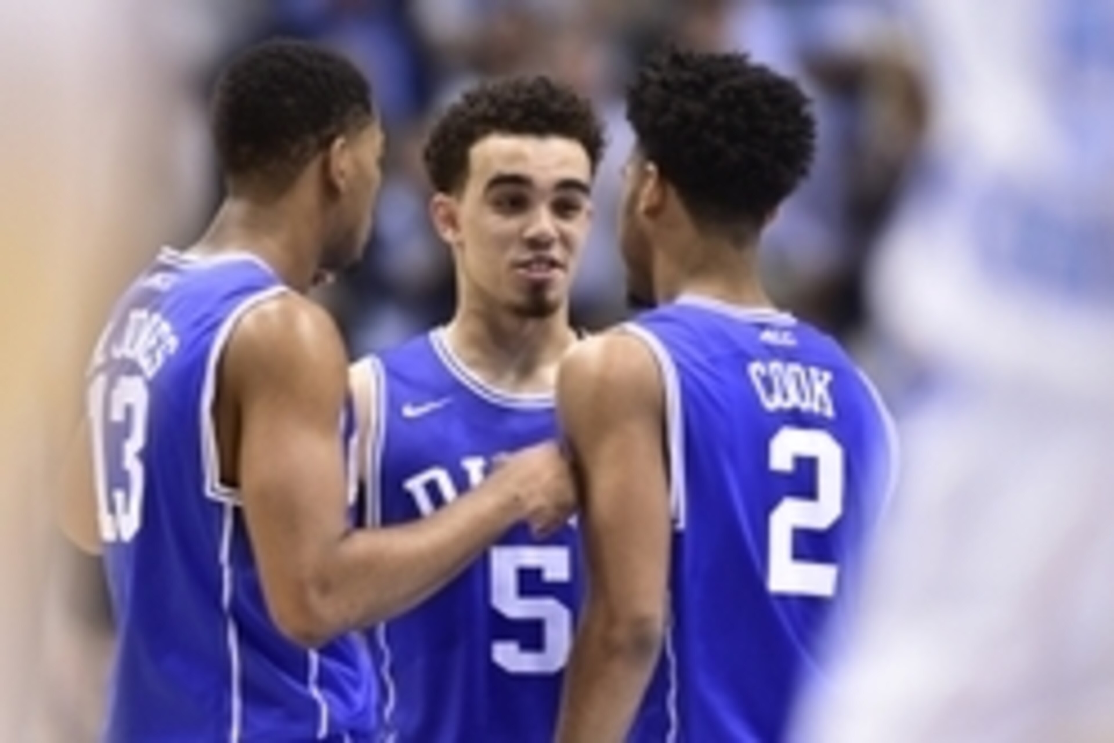 Mar 7, 2015; Chapel Hill, NC, USA; Duke Blue Devils guards Matt Jones (13) and Tyus Jones (5) and Quinn Cook (2) react toward the end of the game. The Blue Devils defeated the Tar Heels 84-77 at Dean E. Smith Center. Mandatory Credit: Bob Donnan-USA TODAY Mar 7, 2015; Chapel Hill, NC, USA; Duke Blue Devils guards Matt Jones (13) and Tyus Jones (5) and Quinn Cook (2) react toward the end of the game. The Blue Devils defeated the Tar Heels 84-77 at Dean E. Smith Center. Mandatory Credit: Bob Donnan-USA TODAY