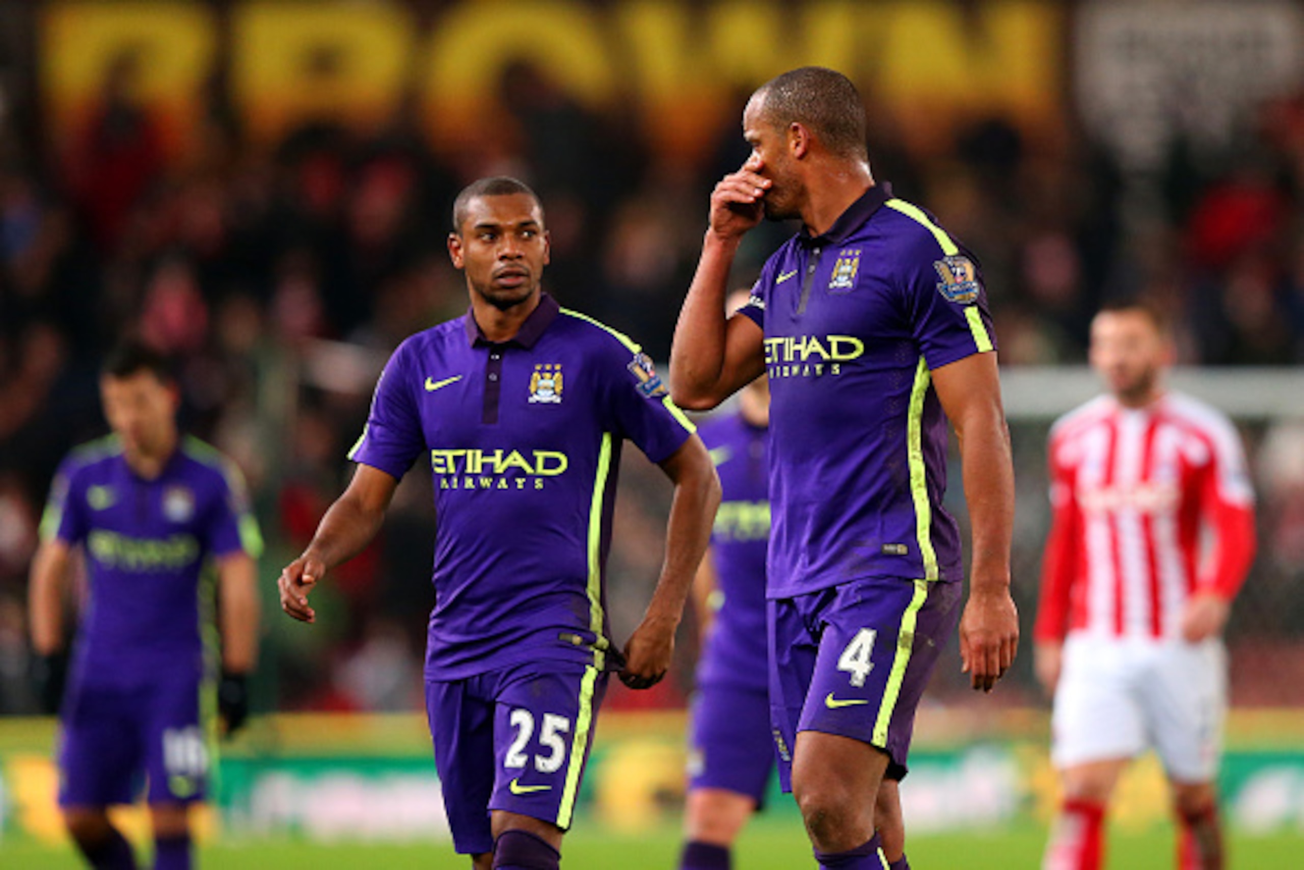 STOKE ON TRENT, ENGLAND - FEBRUARY 11: Vincent Kompany of Manchester City speaks with team-mate Fernandinho during the Barclays Premier League match between Stoke City and Manchester City at Britannia Stadium on February 11, 2015 in Stoke on Trent, Engla STOKE ON TRENT, ENGLAND - FEBRUARY 11: Vincent Kompany of Manchester City speaks with team-mate Fernandinho during the Barclays Premier League match between Stoke City and Manchester City at Britannia Stadium on February 11, 2015 in Stoke on Trent, Engla