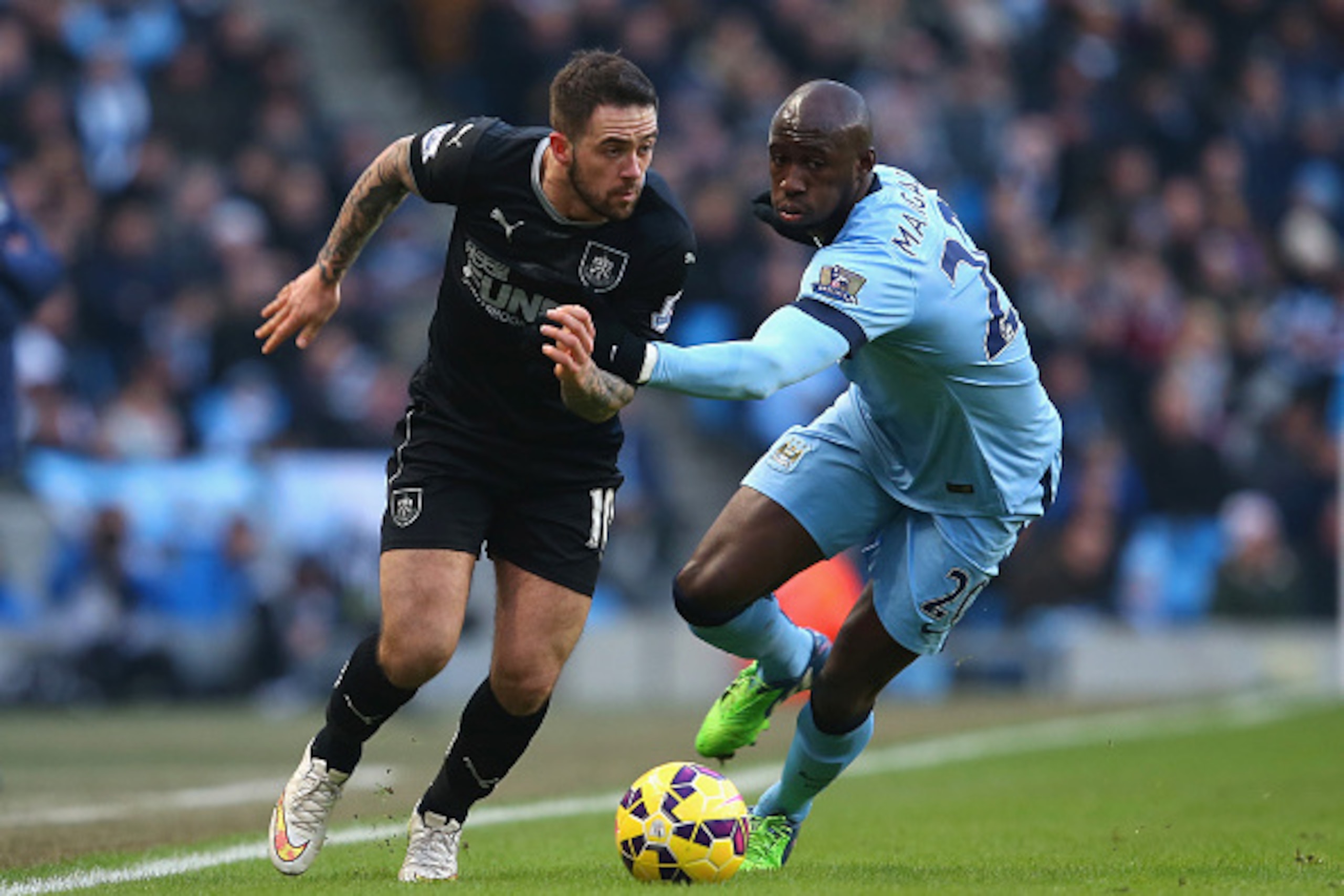 MANCHESTER, ENGLAND - DECEMBER 28: Danny Ings of Burnley is marshalled by Eliaquim Mangala of Manchester City during the Barclays Premier League match between Manchester City and Burnley at Etihad Stadium on December 28, 2014 in Manchester, England. (Ph MANCHESTER, ENGLAND - DECEMBER 28: Danny Ings of Burnley is marshalled by Eliaquim Mangala of Manchester City during the Barclays Premier League match between Manchester City and Burnley at Etihad Stadium on December 28, 2014 in Manchester, England. (Ph