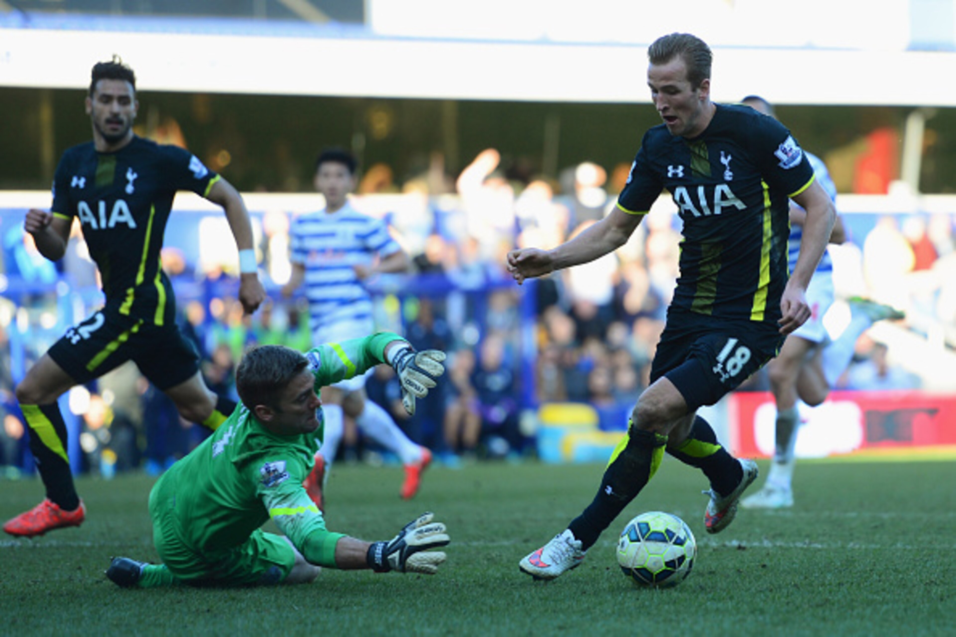 LONDON, ENGLAND - MARCH 07: Harry Kane of Spurs beats goalkeeper Robert Green of QPR as he scores their second goal during the Barclays Premier League match between Queens Park Rangers and Tottenham Hotspur at Loftus Road on March 7, 2015 in London, Engl LONDON, ENGLAND - MARCH 07: Harry Kane of Spurs beats goalkeeper Robert Green of QPR as he scores their second goal during the Barclays Premier League match between Queens Park Rangers and Tottenham Hotspur at Loftus Road on March 7, 2015 in London, Engl