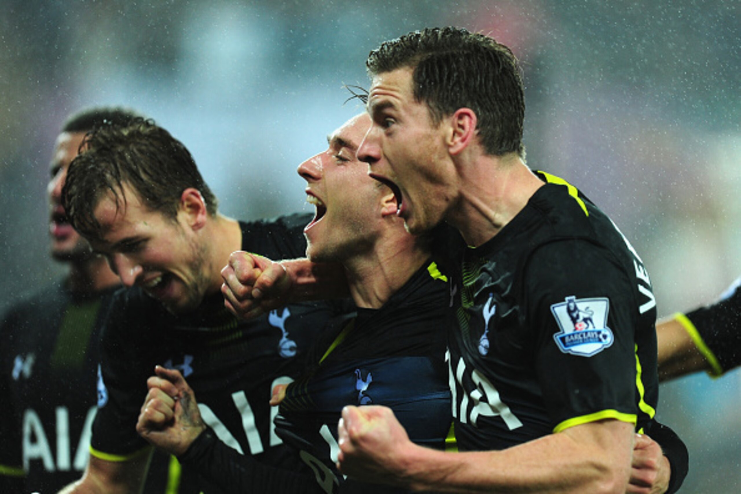 SWANSEA, WALES - DECEMBER 14:  Spurs player Christian Eriksen (c) celebrates with Harry Kane (l) and Jan Vertonghen after scoring the second Spurs goal during the Barclays Premier League match between Swansea City and Tottenham Hotspur at Liberty Stadium 