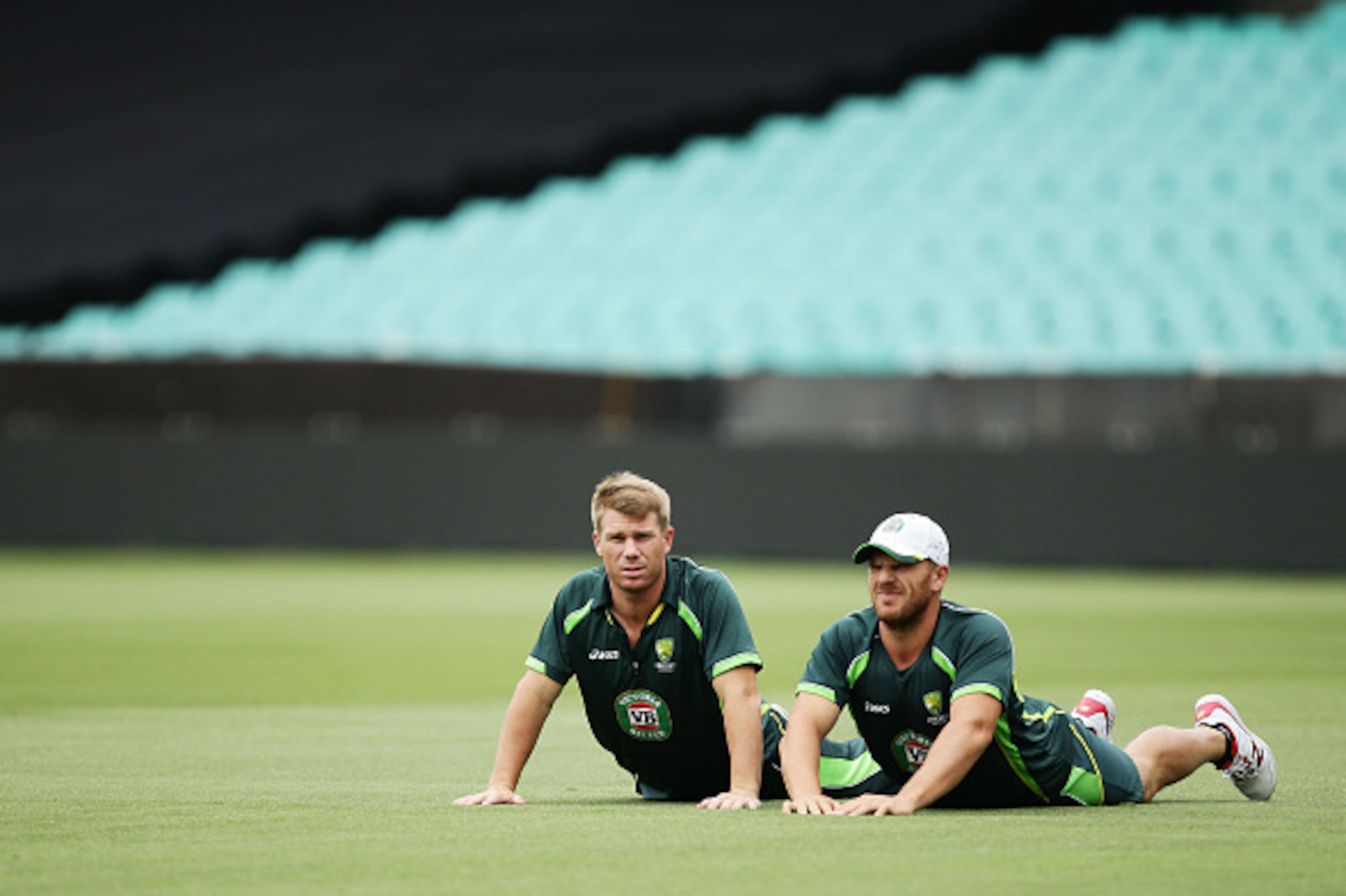 SYDNEY, AUSTRALIA - MARCH 07:  David Warner (L) and Aaron Finch (R) of Australia stretch during an Australia nets session at Sydney Cricket Ground on March 7, 2015 in Sydney, Australia.  (Photo by Matt King/Getty Images)