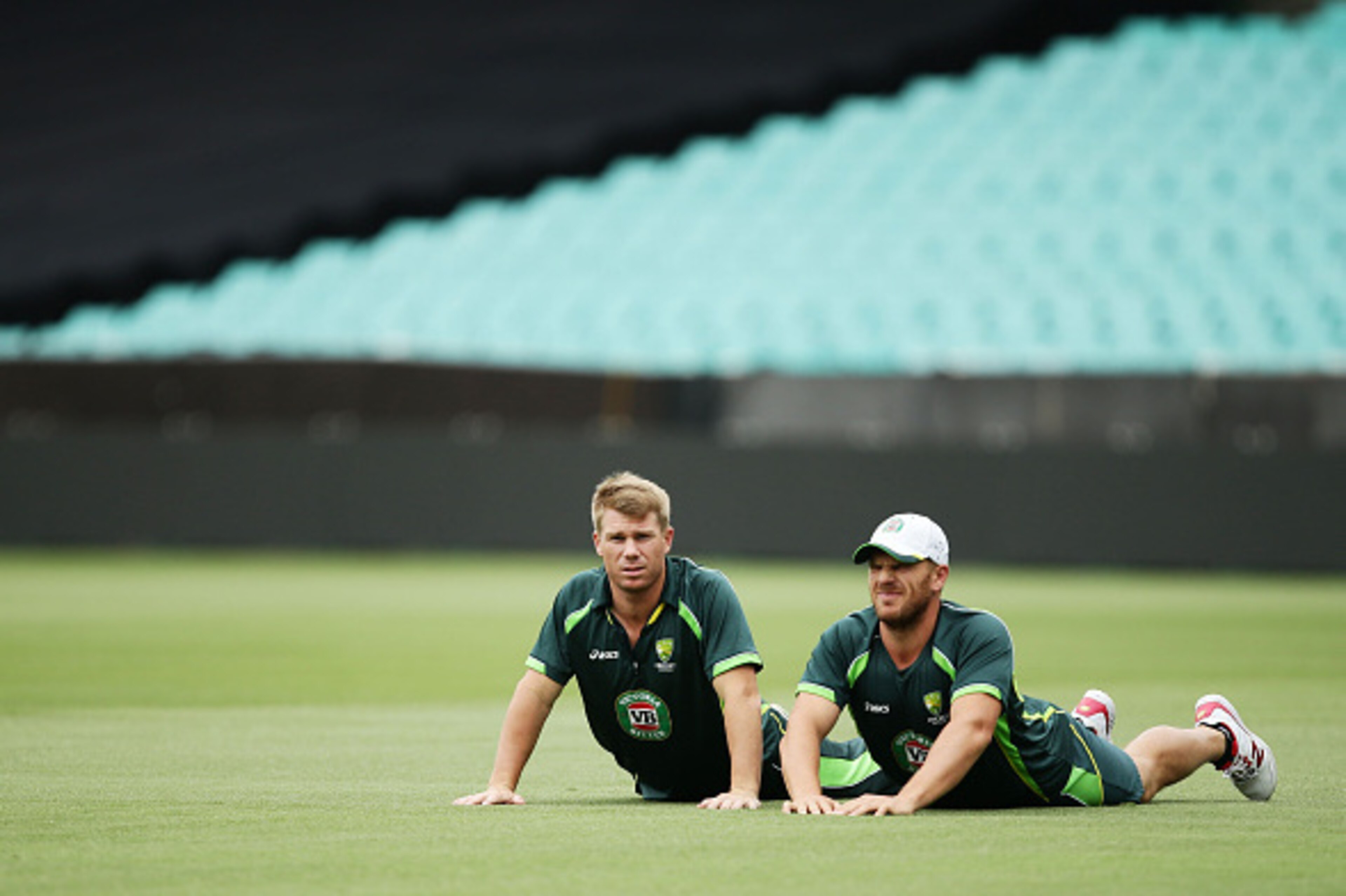 SYDNEY, AUSTRALIA - MARCH 07:  David Warner (L) and Aaron Finch (R) of Australia stretch during an Australia nets session at Sydney Cricket Ground on March 7, 2015 in Sydney, Australia.  (Photo by Matt King/Getty Images)