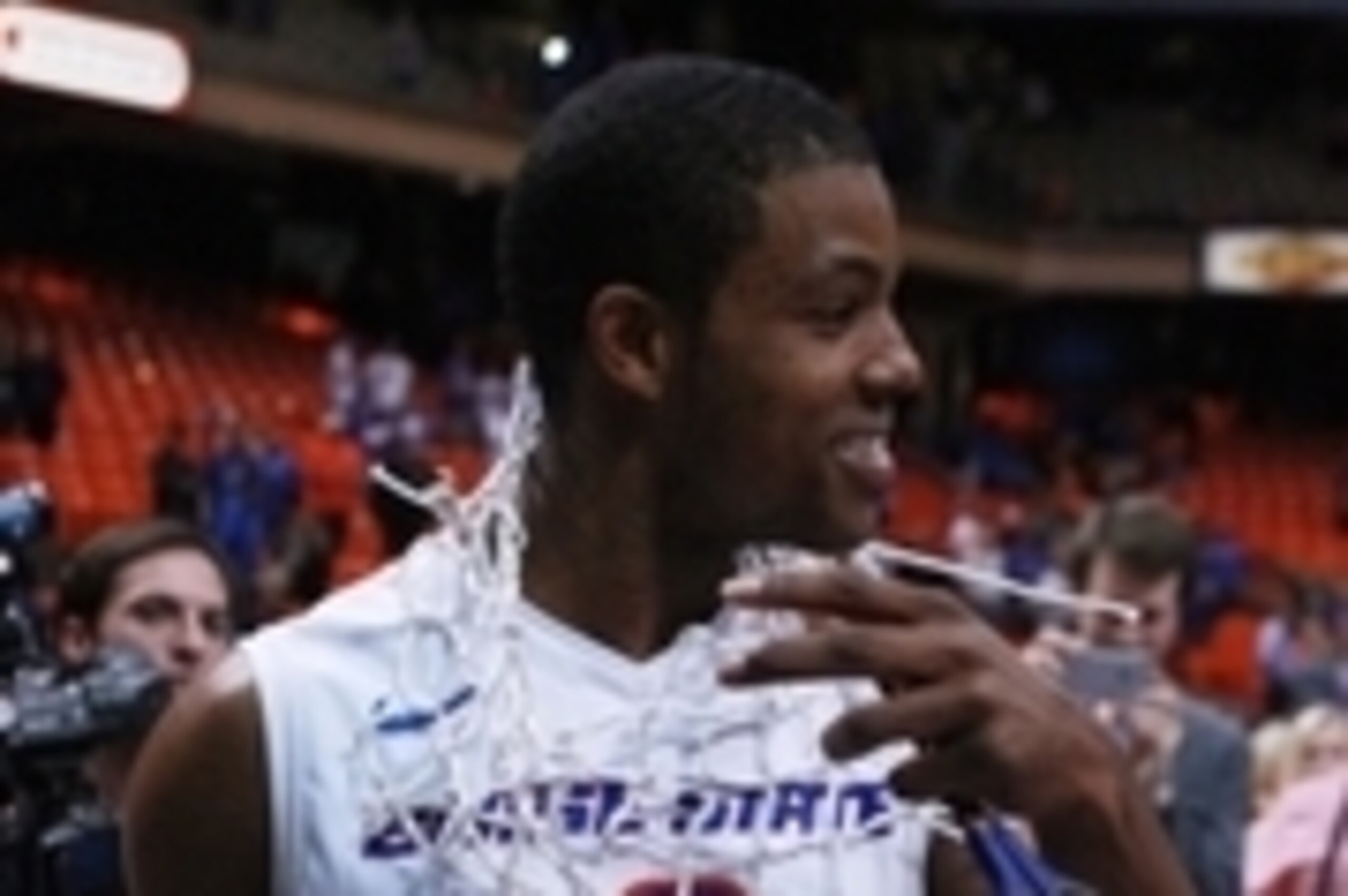 Mar 7, 2015; Boise, ID, USA; Boise State Broncos guard Derrick Marks (2) walks around after cutting down the nets as Boise State defeats Fresno State 71-52 to take a share of the Mountain West Conference championship at Taco Bell Arena.  Mandatory Credit: