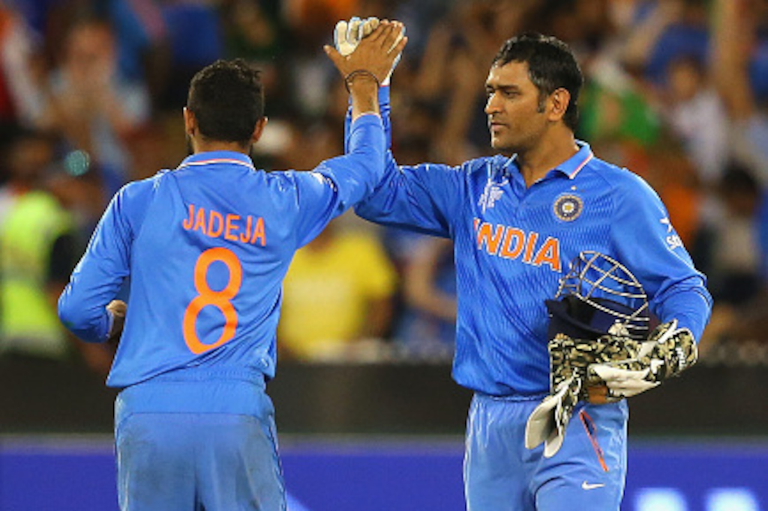 MELBOURNE, AUSTRALIA - FEBRUARY 22: Ravindra Jadeja and MS Dhoni of India celebrate winning the 2015 ICC Cricket World Cup match between South Africa and India at Melbourne Cricket Ground on February 22, 2015 in Melbourne, Australia.  (Photo by Quinn Roon