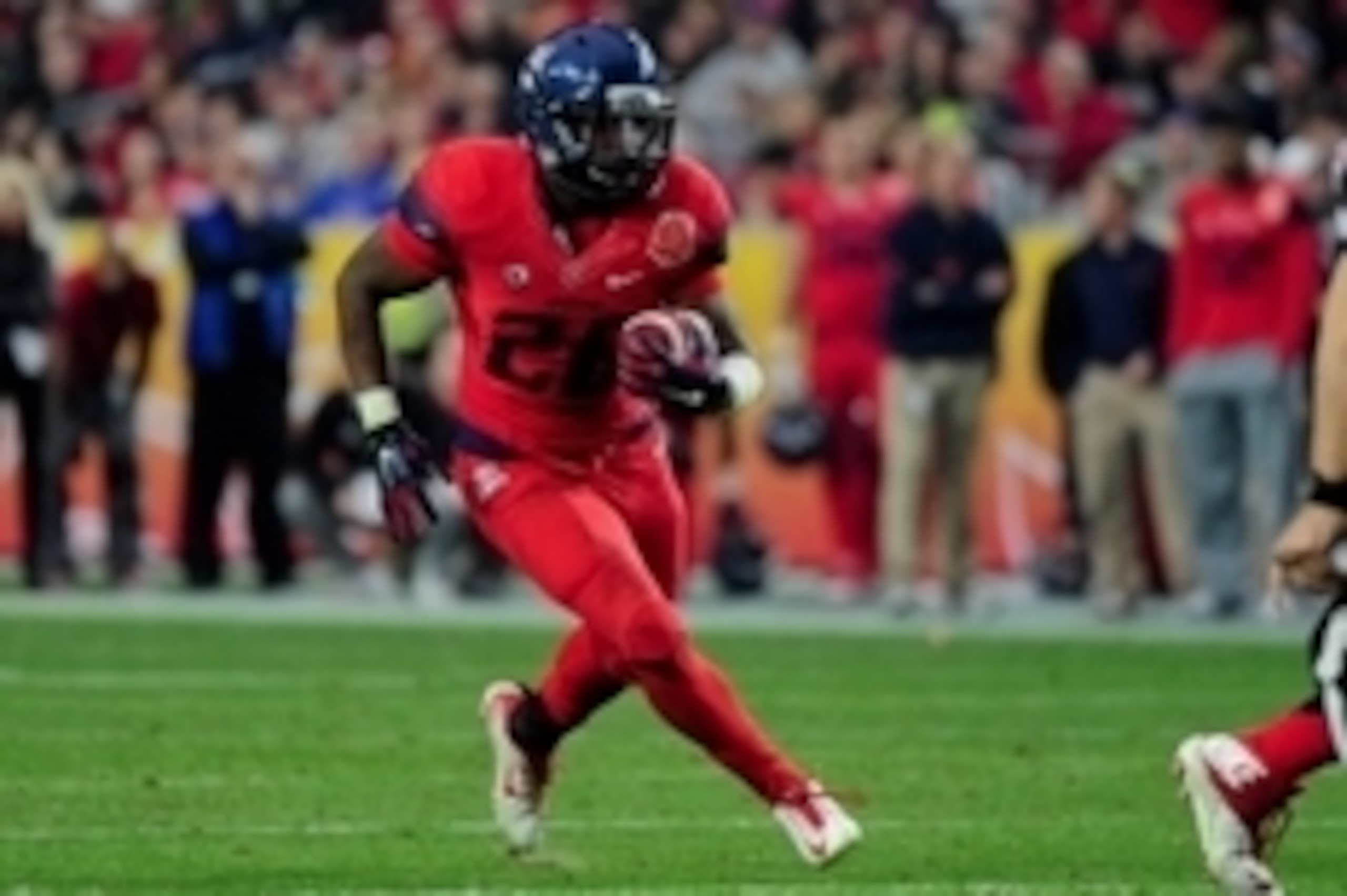 Dec 31, 2014; Glendale, AZ, USA; Arizona Wildcats running back Nick Wilson (28) carries the ball during the first half against the Boise State Broncos in the 2014 Fiesta Bowl at Phoenix Stadium. Mandatory Credit: Matt Kartozian-USA TODAY Sports