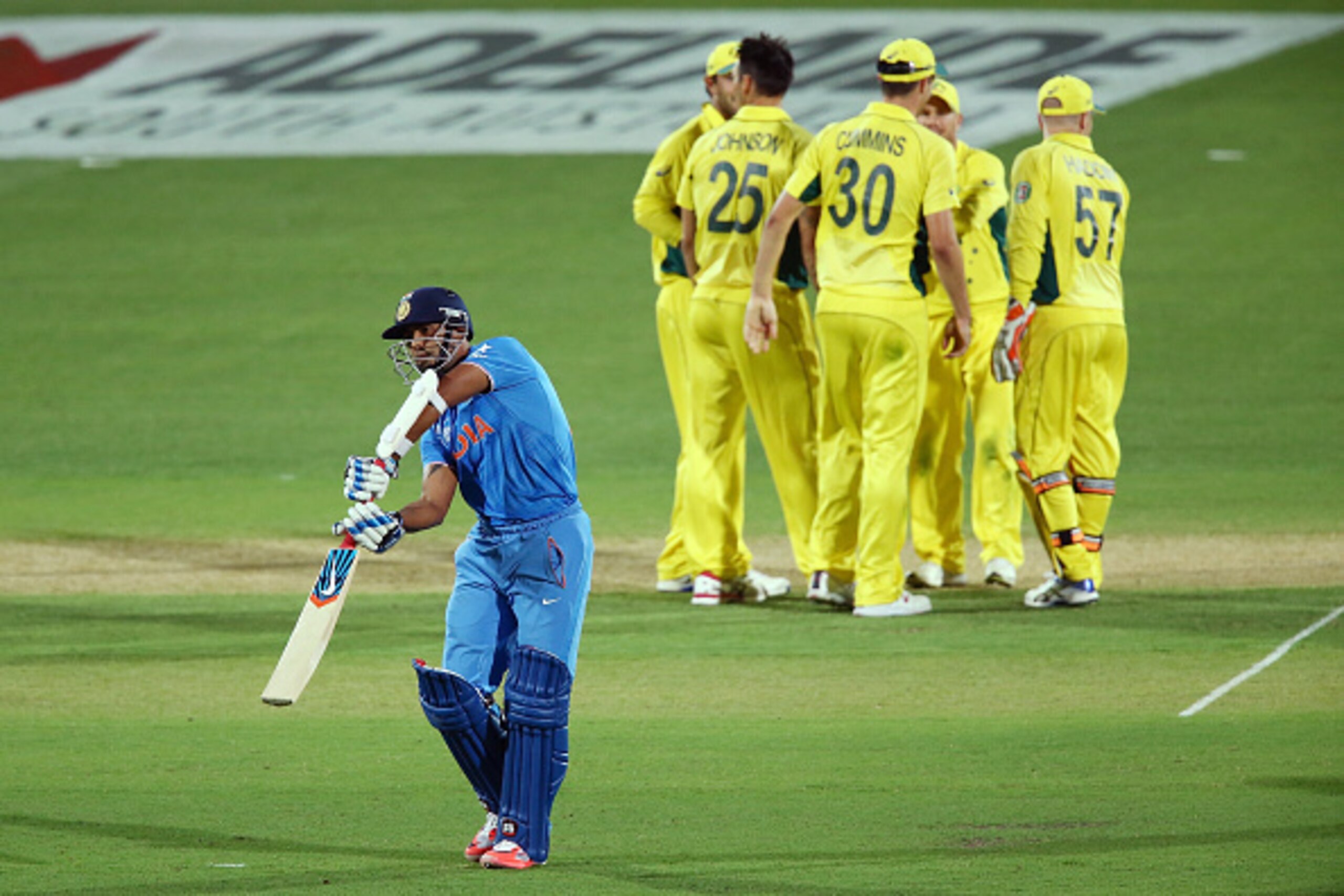ADELAIDE, AUSTRALIA - FEBRUARY 08: Stuart Binny (L) of India leaves the field after getting out to Mitchell Johnson of Australia during the ICC Cricket World Cup warm up match between Australia and India at Adelaide Oval on February 8, 2015 in Adelaide, A