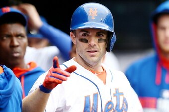 NEW YORK, NY - MAY 28:  David Wright #5 of the New York Mets celebrates in the dugout after his solo home run in the sixth inning against the Pittsburgh Pirates on May 28, 2014 at Citi Field in the Flushing neighborhood of the Queens borough of New York C