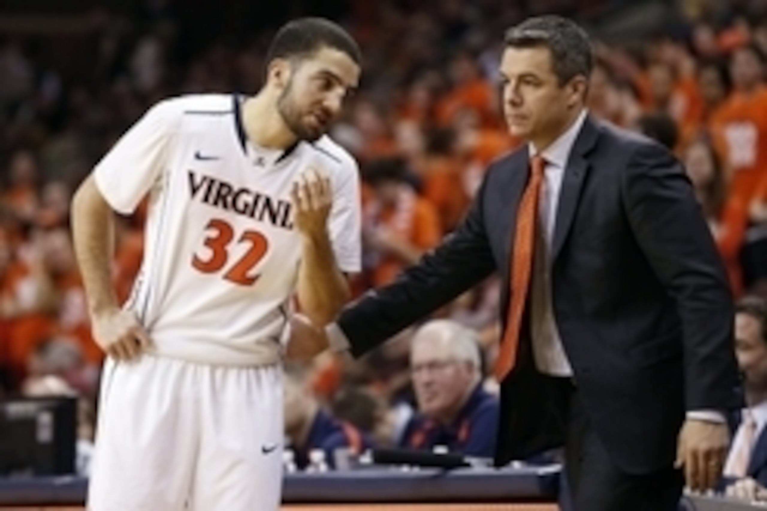 Feb 28, 2015; Charlottesville, VA, USA; Virginia Cavaliers guard London Perrantes (32) talks with Cavaliers head coach Tony Bennett (right) against the Virginia Tech Hokies in the second half at John Paul Jones Arena. The Cavaliers won 69-57. Mandatory Cr