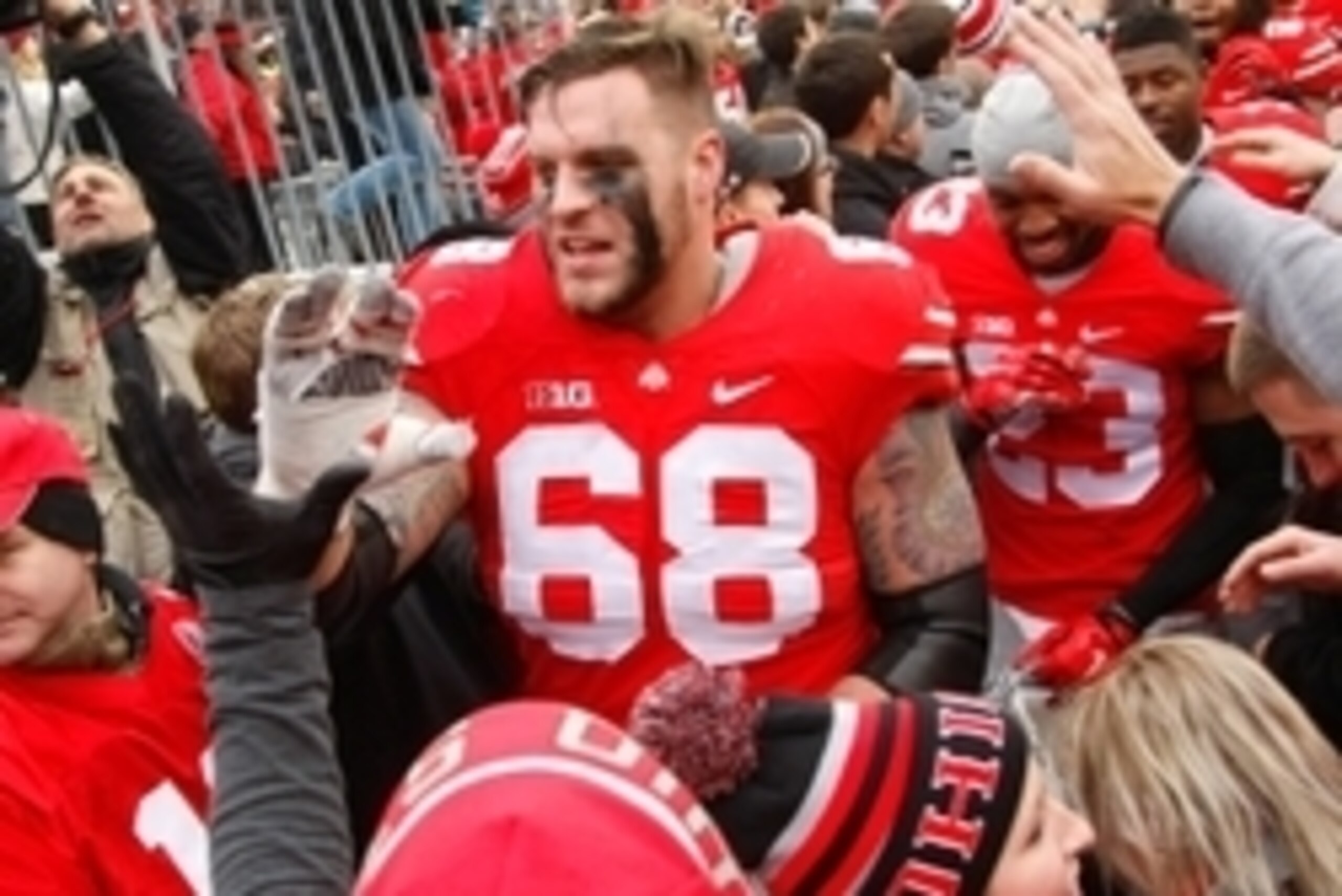 Nov 29, 2014; Columbus, OH, USA; Ohio State Buckeyes offensive lineman Taylor Decker (68) celebrates with fans following the game versus the Michigan Wolverines at Ohio Stadium. Ohio State won the game 42-28. Mandatory Credit: Joe Maiorana-USA TODAY Spor Nov 29, 2014; Columbus, OH, USA; Ohio State Buckeyes offensive lineman Taylor Decker (68) celebrates with fans following the game versus the Michigan Wolverines at Ohio Stadium. Ohio State won the game 42-28. Mandatory Credit: Joe Maiorana-USA TODAY Spor