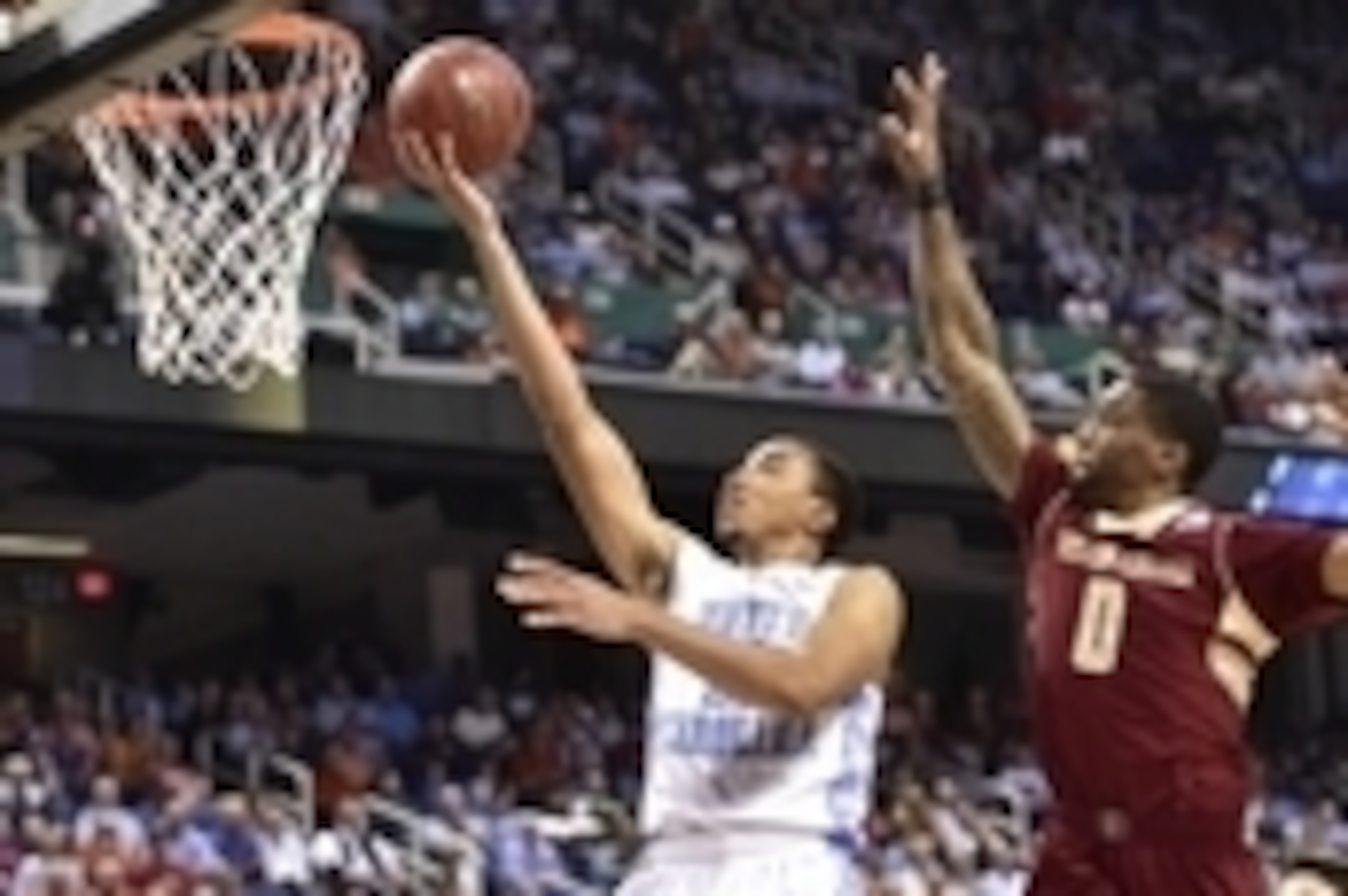 Mar 11, 2015; Greensboro, NC, USA; North Carolina Tar Heels forward Brice Johnson (11) shoots as Boston College Eagles forward Garland Owens (0) defends in the first half in the second round at Greensboro Coliseum. Mandatory Credit: Bob Donnan-USA TODAY S
